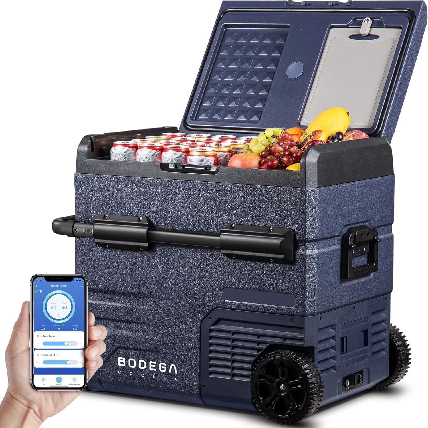 BODEGA 55L compressor car refrigerator with its lid open, filled with drinks and fruit, and a smartphone displaying the control app next to it.