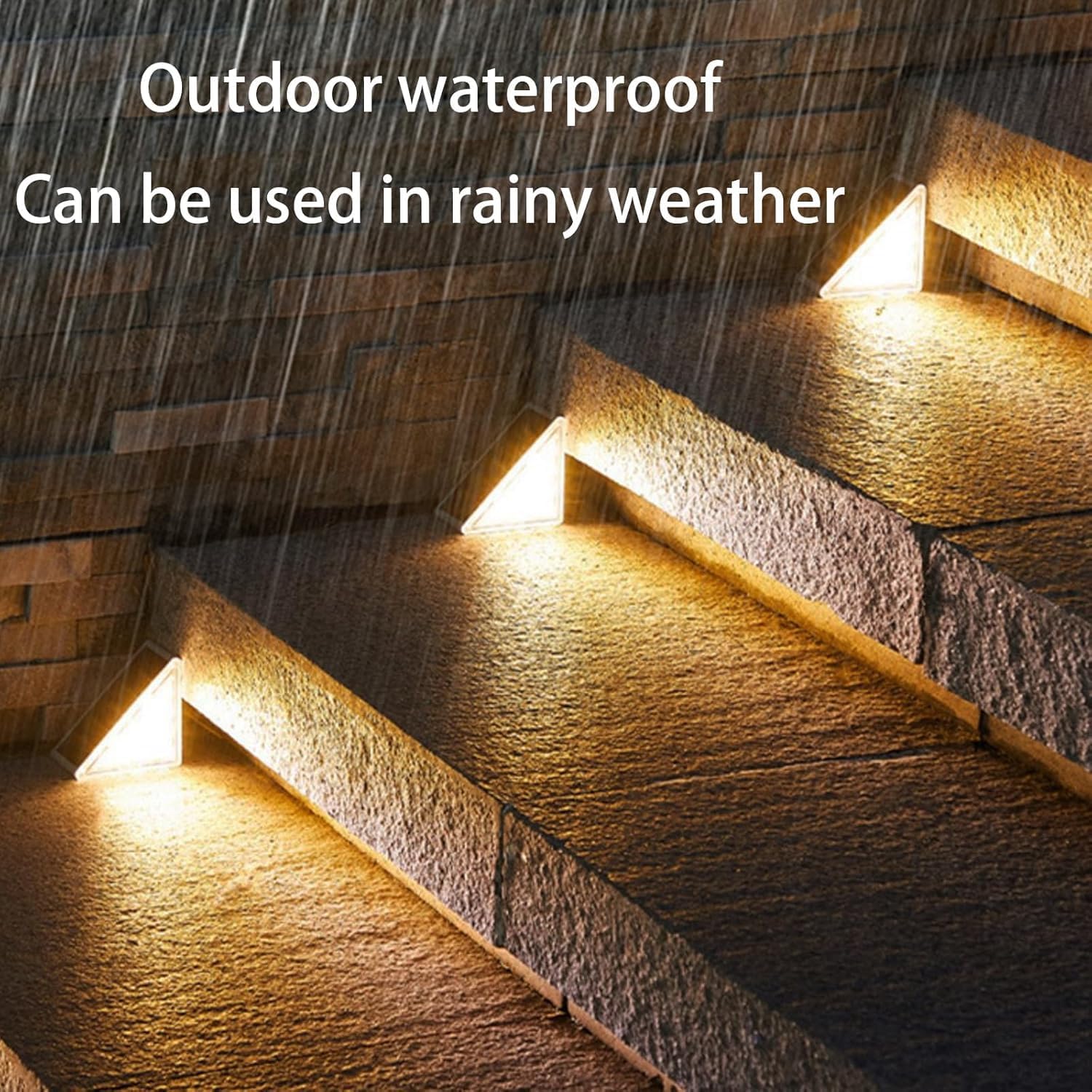 Nordikhome Solar Stair Lights installed on outdoor steps during a rain shower, demonstrating their waterproof capability