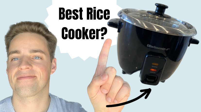 Elite Gourmet rice cooker with its stainless steel inner pot removed, showing the heating element inside the base. The glass lid is also visible.