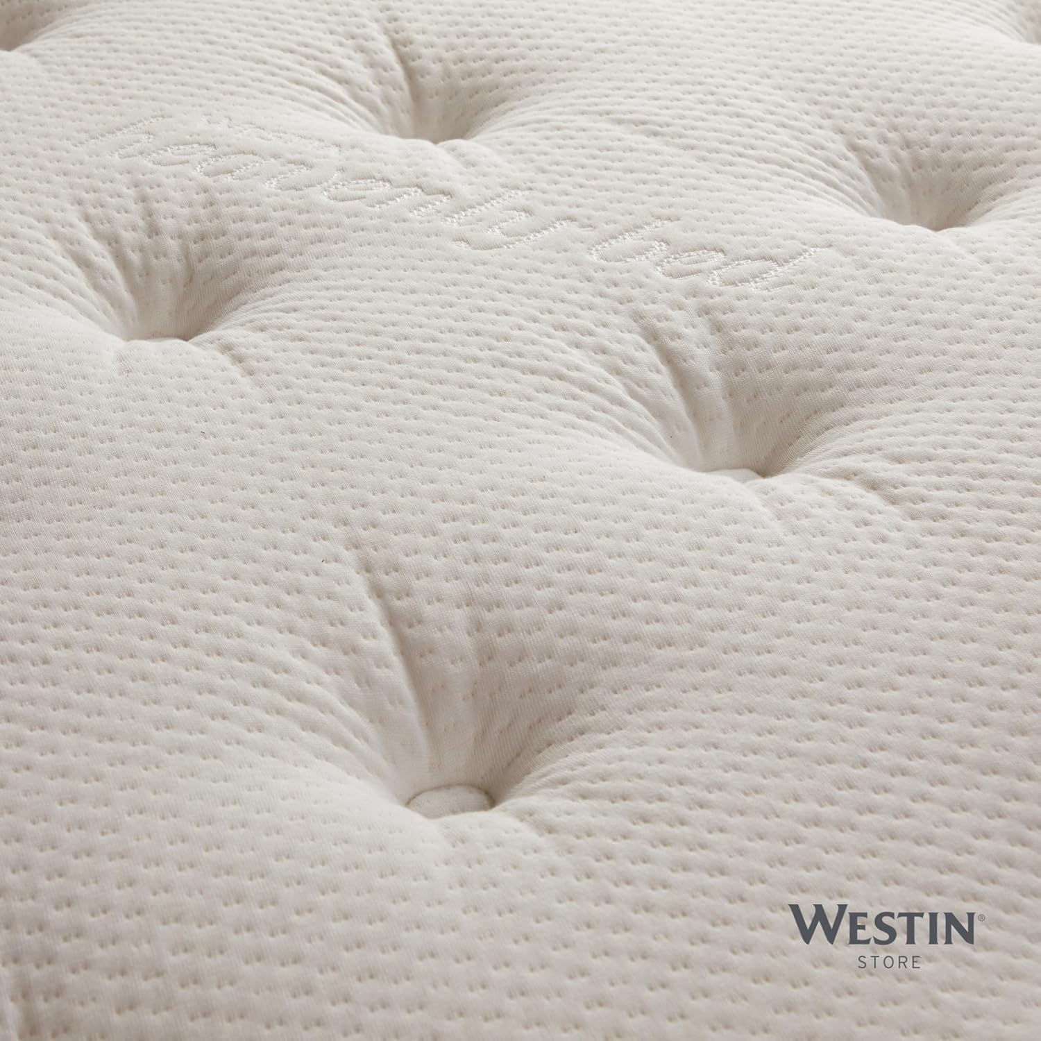 Close-up view of the quilted top surface of the Westin Heavenly Bed mattress, showing the texture and stitching.