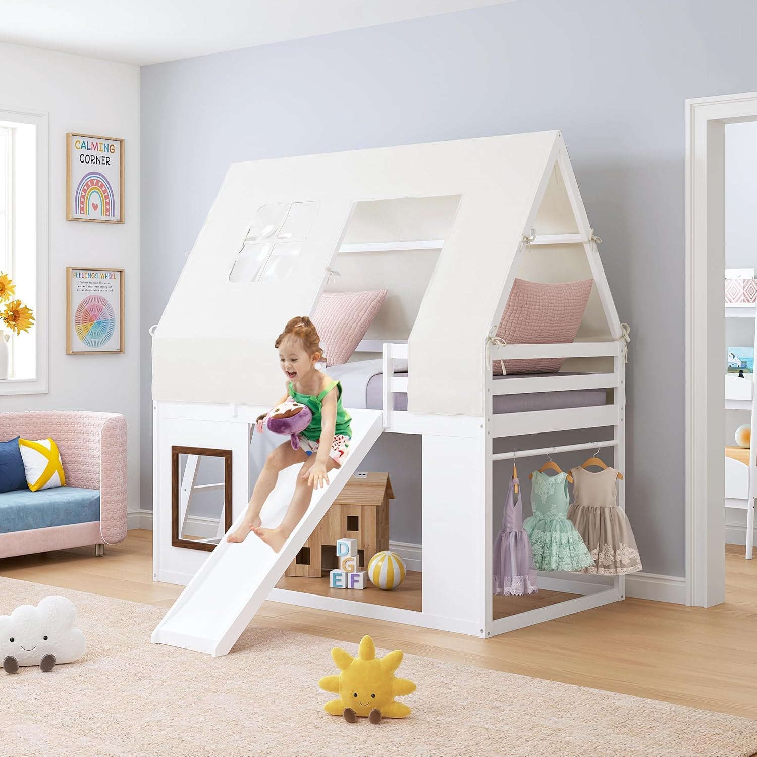 Child enjoying the slide from the bunk bed