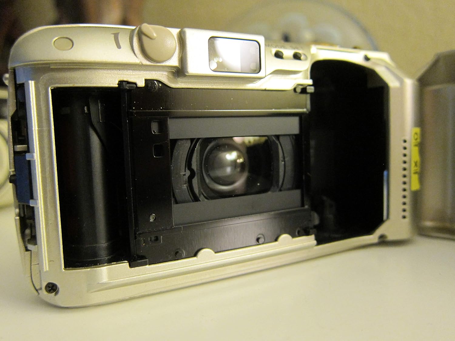 Inside of the film compartment of the OM SYSTEM OLYMPUS Stylus Epic Zoom 80 DLX 35mm Camera