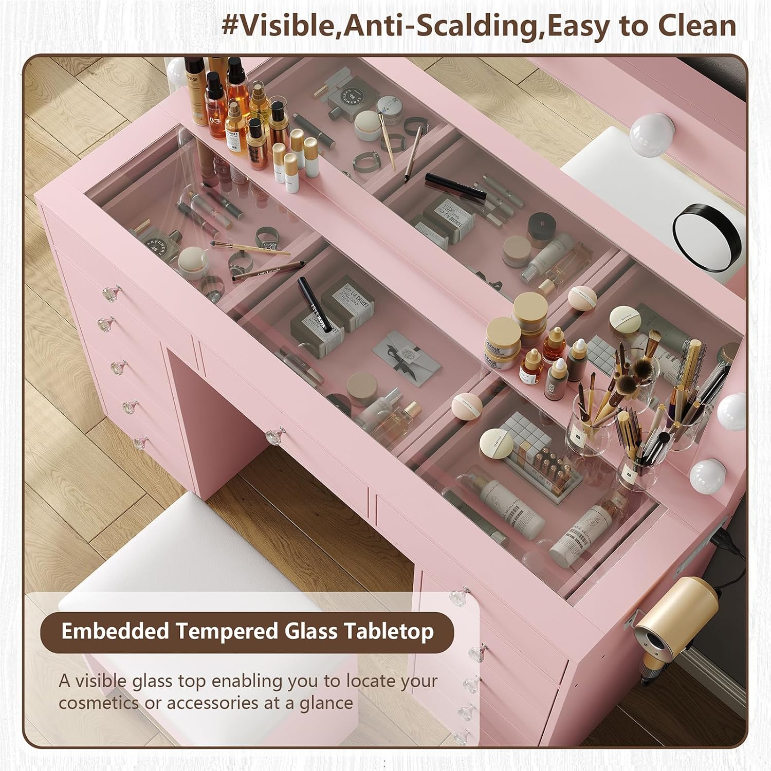 Overhead view of the glass top vanity desk with cosmetics and accessories visible in the drawers below.