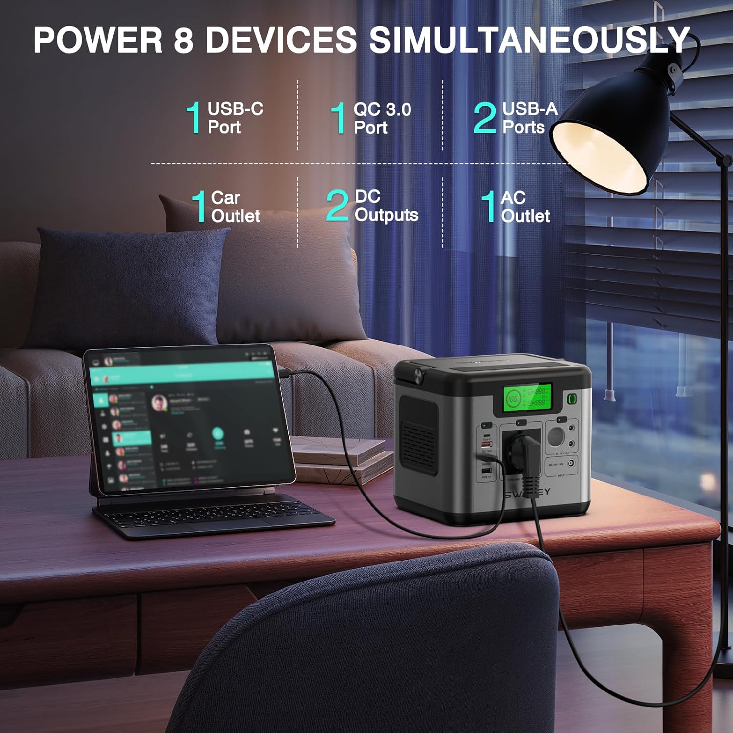 SWAREY S500 powering a laptop and other devices on a wooden table outdoors.
