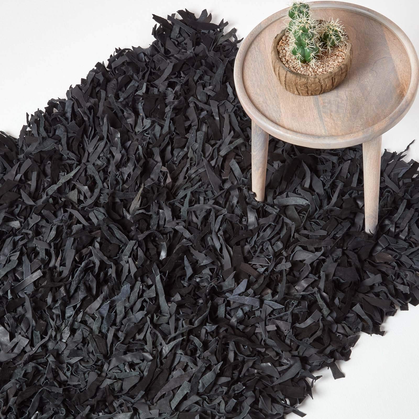Homescapes Lederteppich Dallas 150 x 240 cm, Fransenteppich aus 100% Echtleder, moderner Shaggy-/Hochflor-Teppich, schwarz