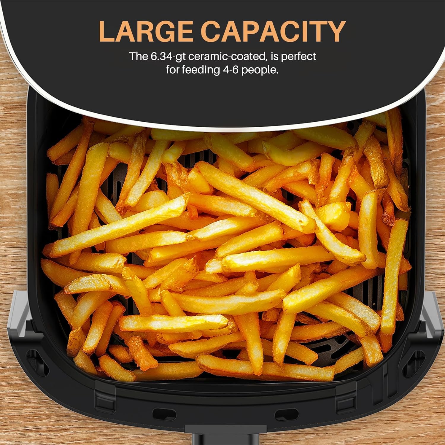Close-up of the large 6-quart air fryer basket filled with french fries, demonstrating its capacity.