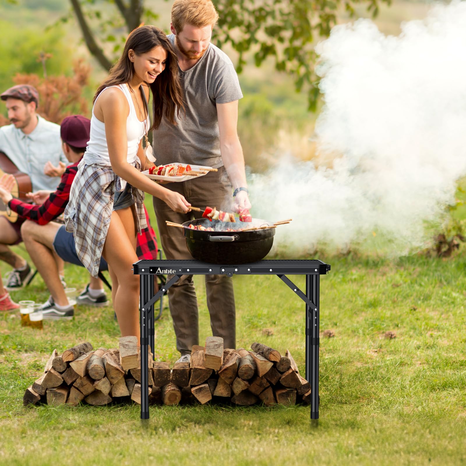 Anbte Mesa Plegable Camping 58 x 40 x 26-48-70cm, Mesa Exterior BBQ Portátil de Malla Metálica Impermeable 3 Altura Ajustable para Exterior/Barbacoa/Jardín/Playa Color Negro