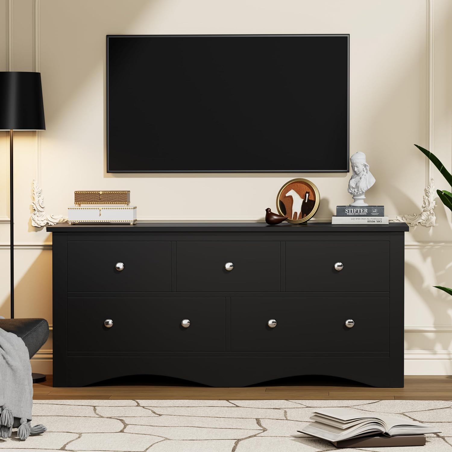 Dresser functioning as a TV stand in a living room