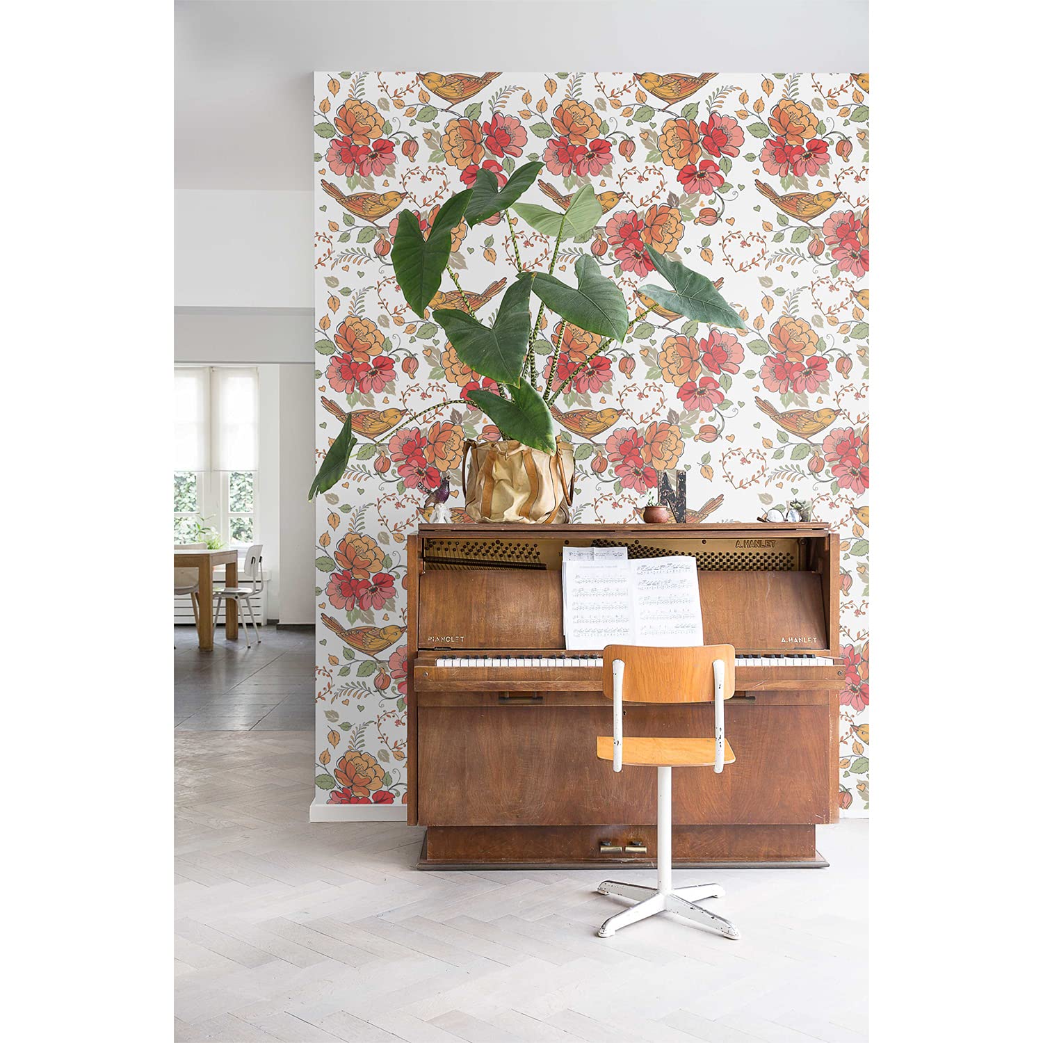 Papier peint oiseaux rouge grand format pour créer une ambiance salon cosy