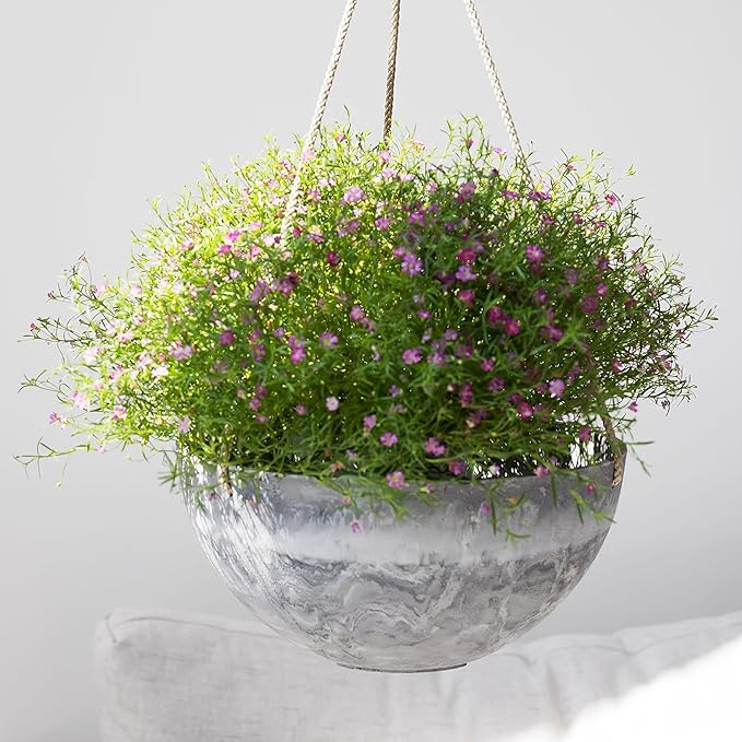 The LA JOLIE MUSE Hanging Planter Flower Plant Pots are a set of two 10-inch hanging baskets designed for indoor or outdoor use. The pots are made of durable and lightweight plastic material, making them easy to hang and move around. The marble pattern adds a touch of elegance to any space and complements a variety of plant styles.