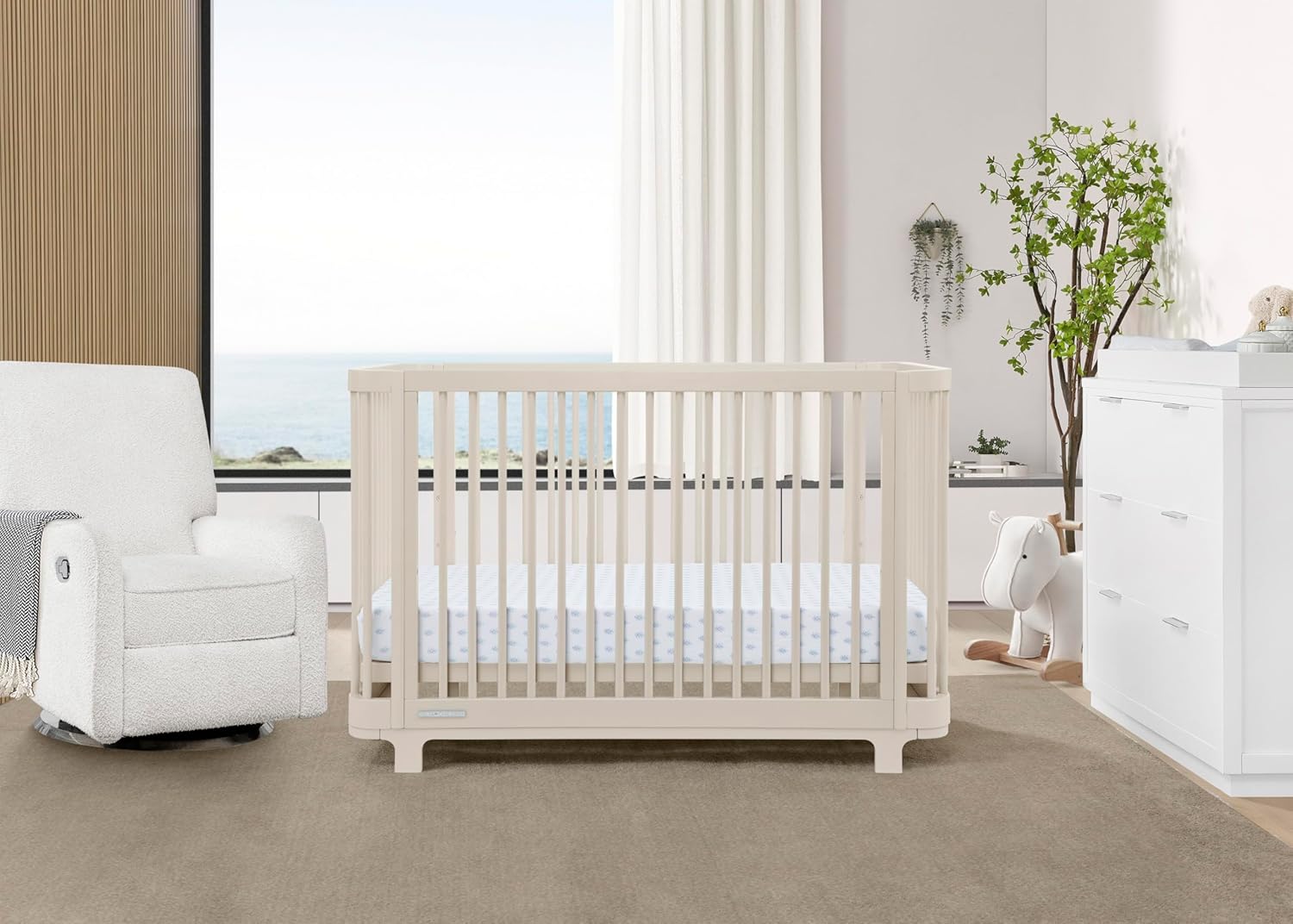 Delta Children Nest 4-in-1 Convertible Crib in a nursery setting