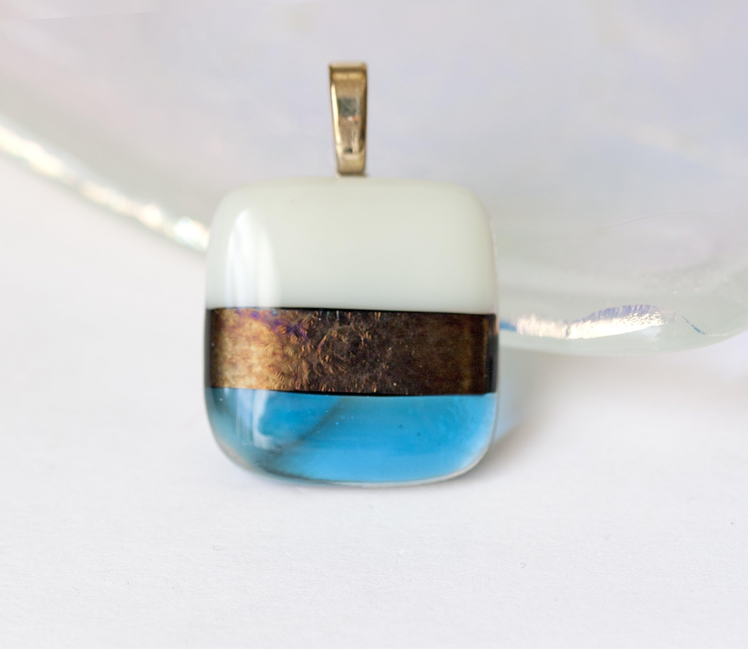 Square Pendant in Stripes of Turquoise Ivory and Dark Gold Iridescent Fused Glass