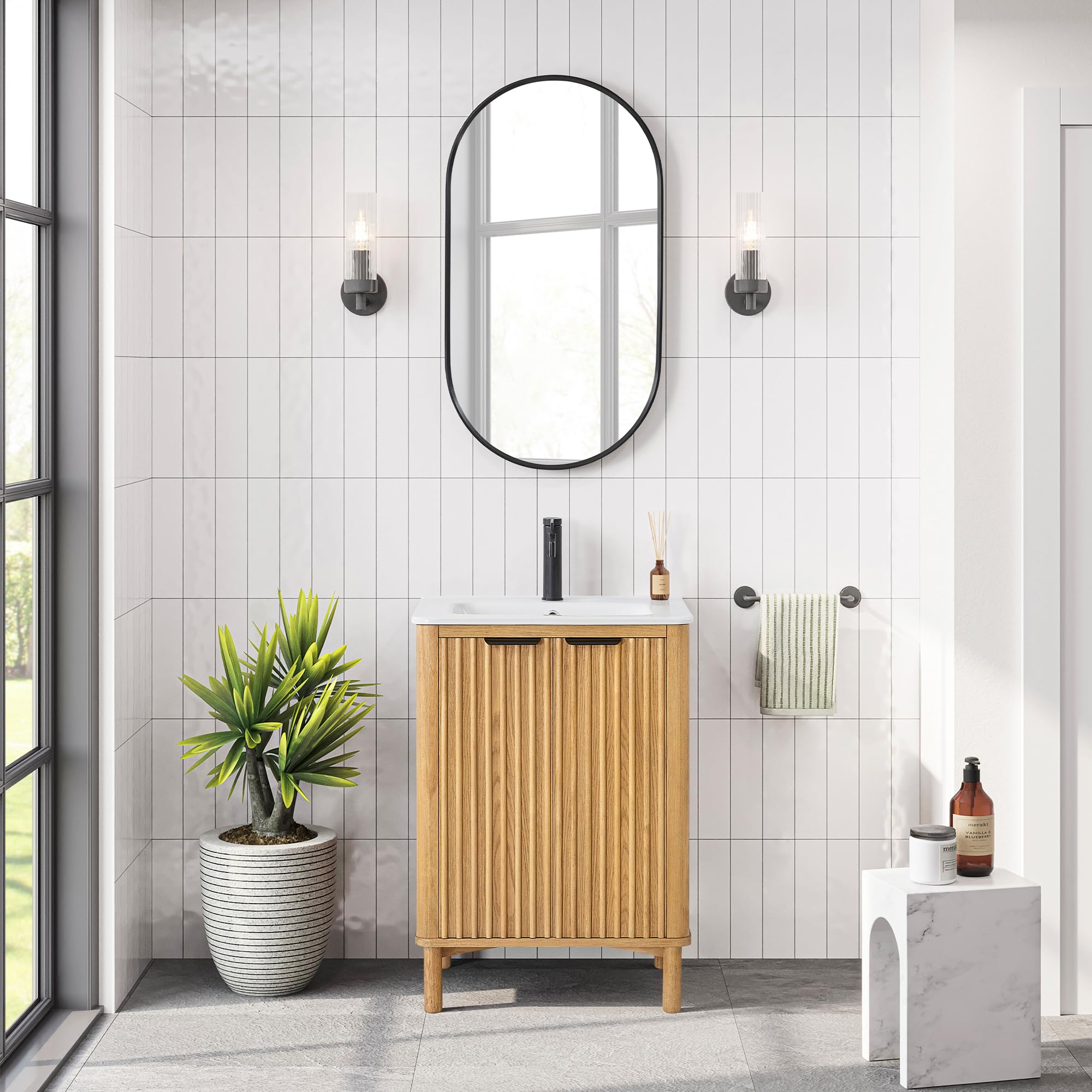 vinnova mumbai single bath vanity in natural weathering oak with fluted doors, single adjustable shelf, black metal handles and white ceramic sink top. 18.1"d x 24"w x 34.1"h