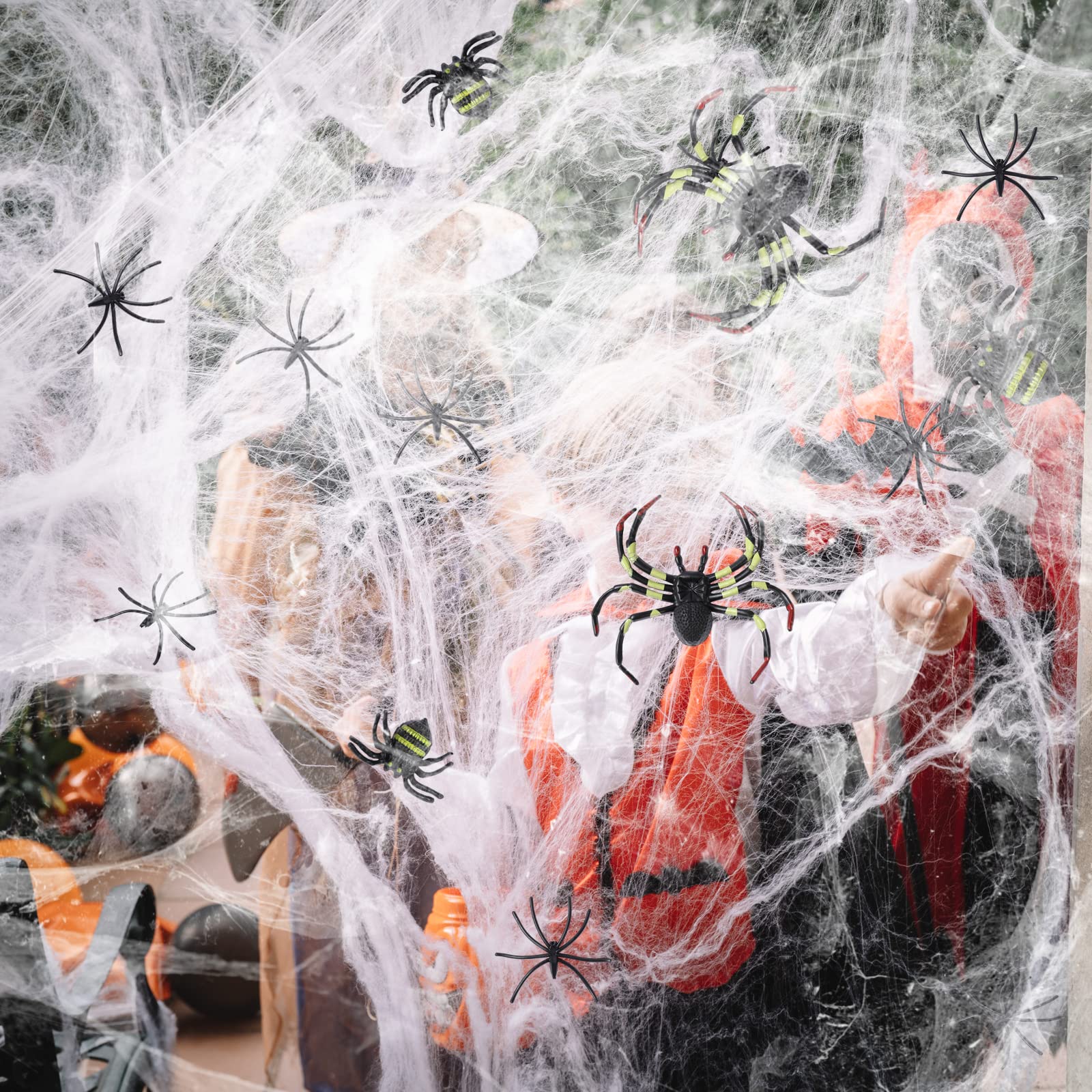 Photo 1 of Berenlu 1100 Sqft Spider Web Decoration, Super Stretchy Halloween Spider Web with 65 Extra Fake Spiders, Halloween Decoration, Creepy Halloween Party Indoor Decoration, Halloween Outdoor Decoration