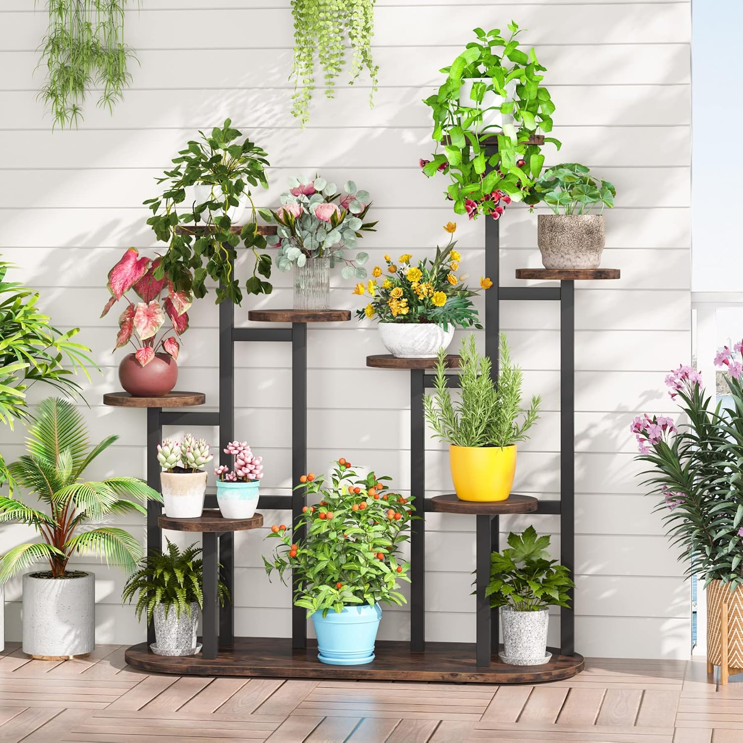 Tribesigns plant stand on a balcony with plants, showing outdoor use.