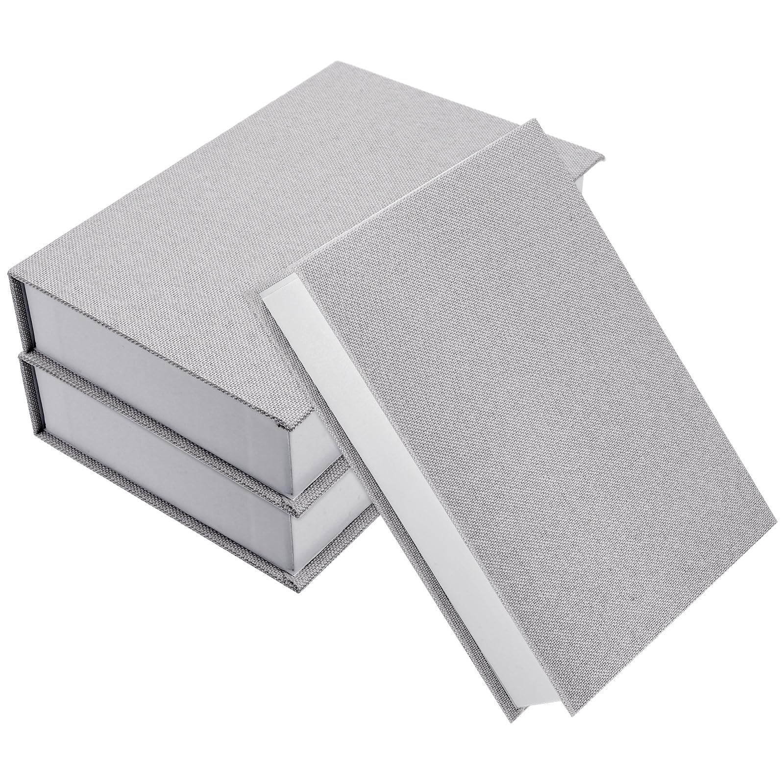 Boîtes décoratives de livre sur table basse, lot en lin pour sublimer un salon moderne