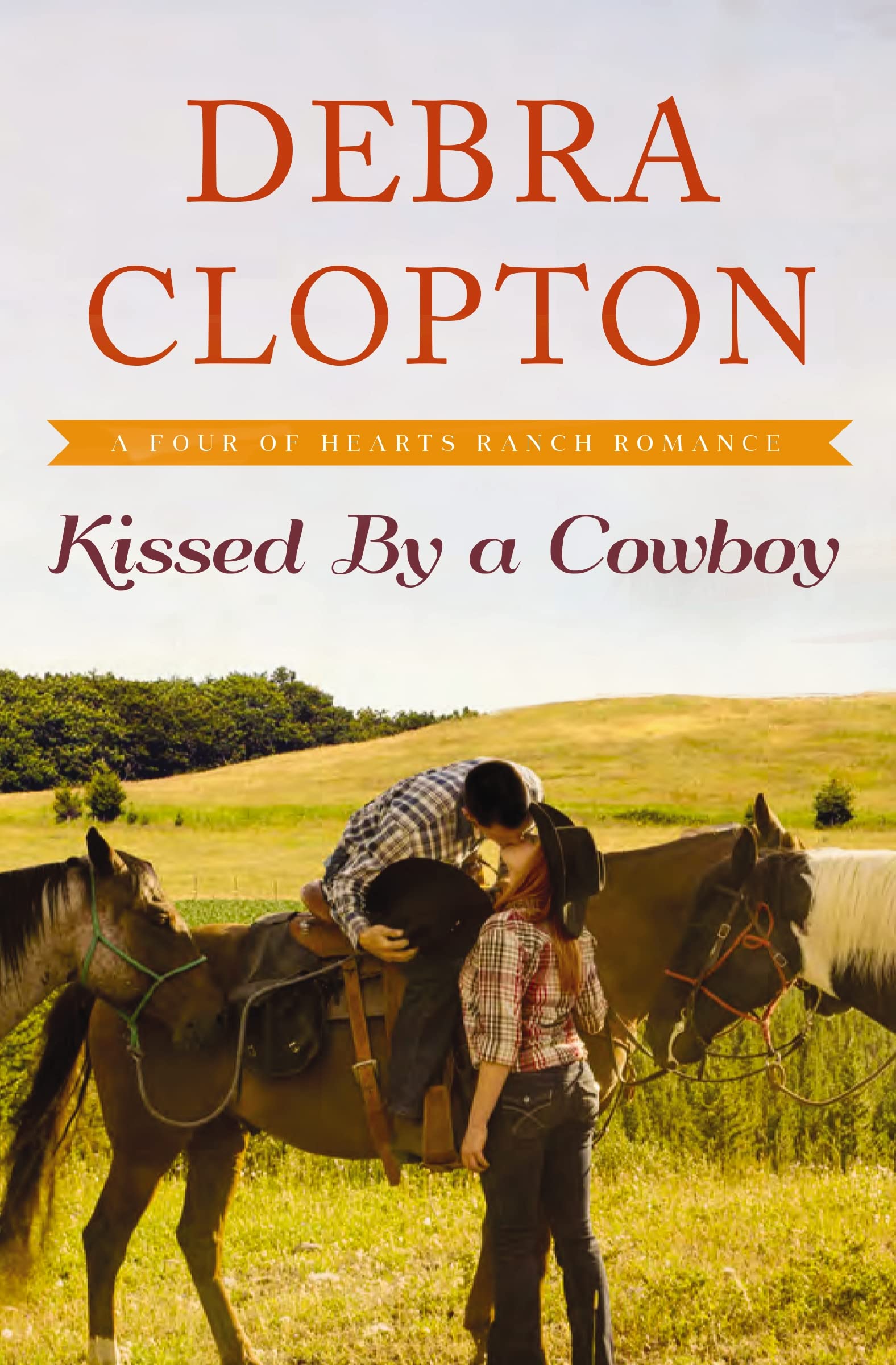 Kissed by a Cowboy: 3 (A Four of Hearts Ranch Romance)