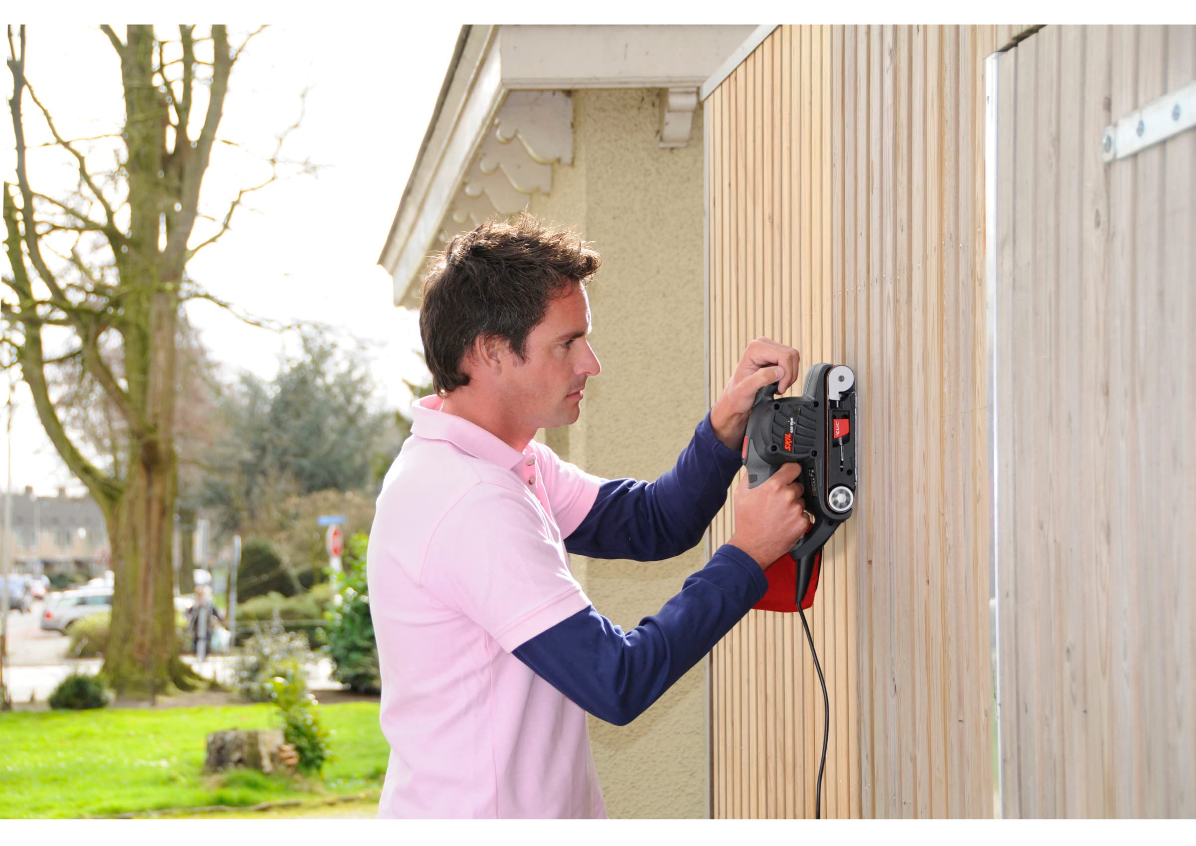 Skil 1210AA - Lijadora de banda (650 W, 76 x 457 mm, sistema de centrado automático de banda, bolsa para el polvo, banda de lija)
