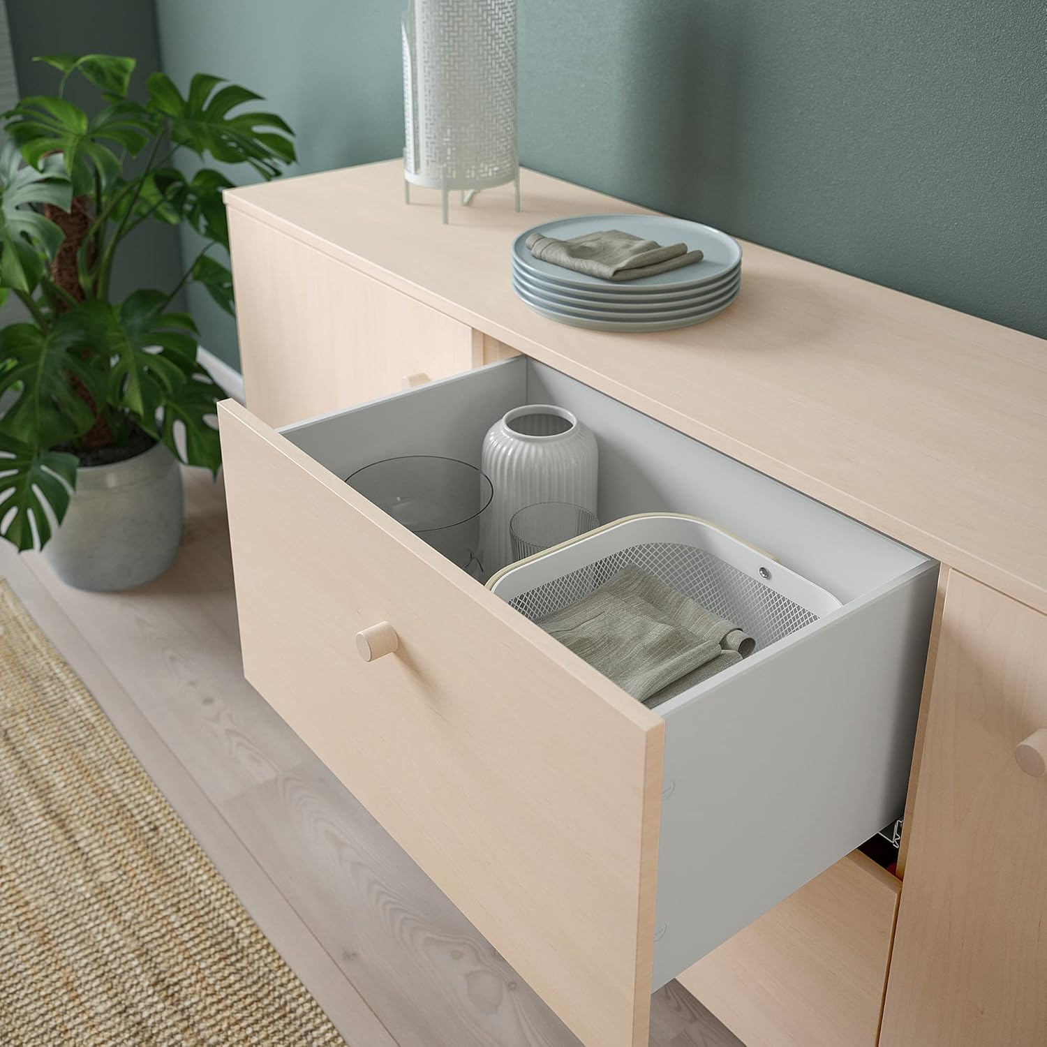 Open drawer of the ERSNÄS Buffet with various household items