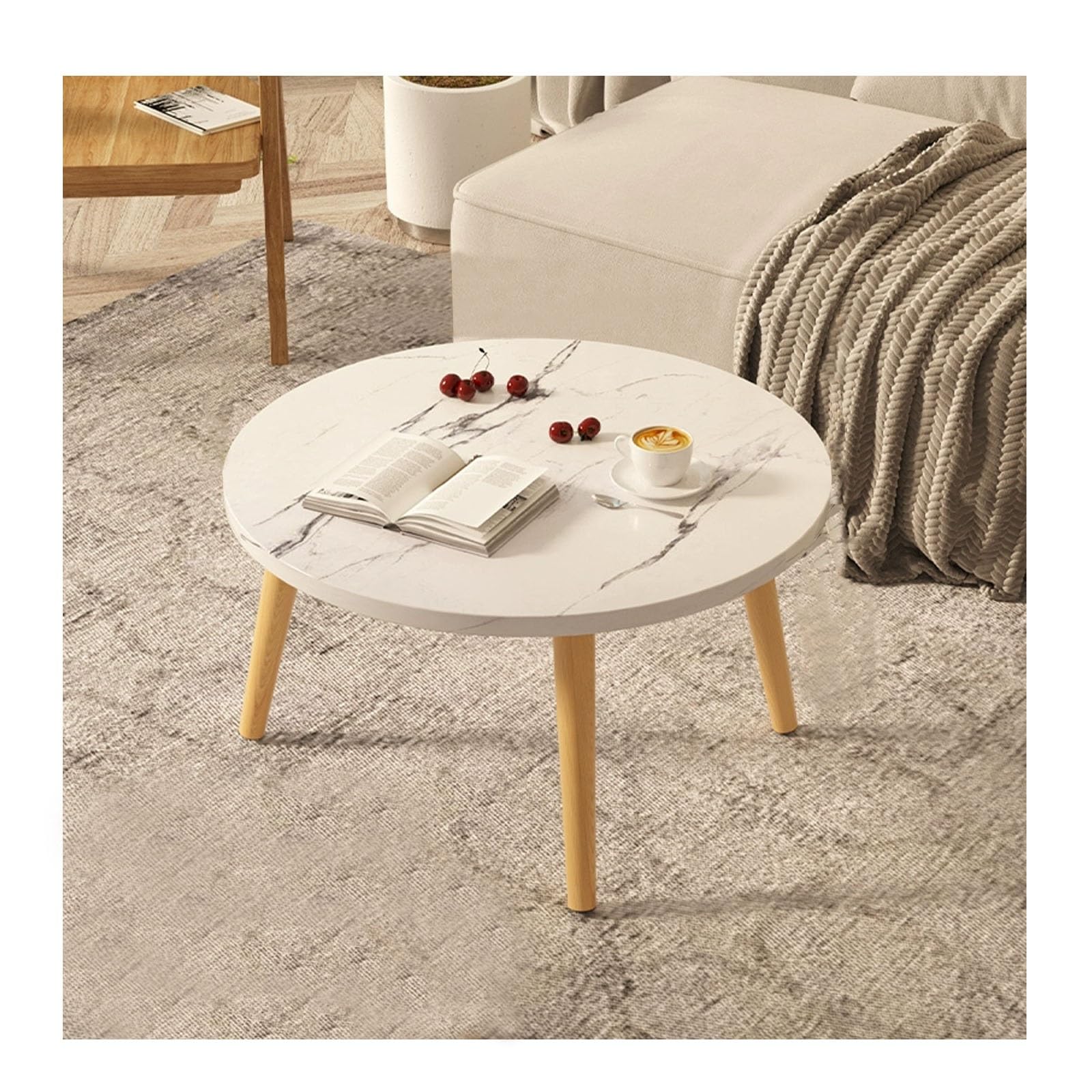 Table basse ronde gain de place et meuble d'exposition pour salon compact