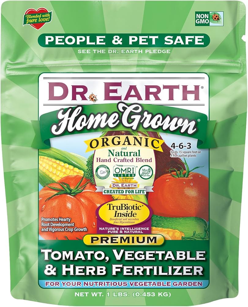 Image of person spreading Dr Earth fruit tree fertilizer