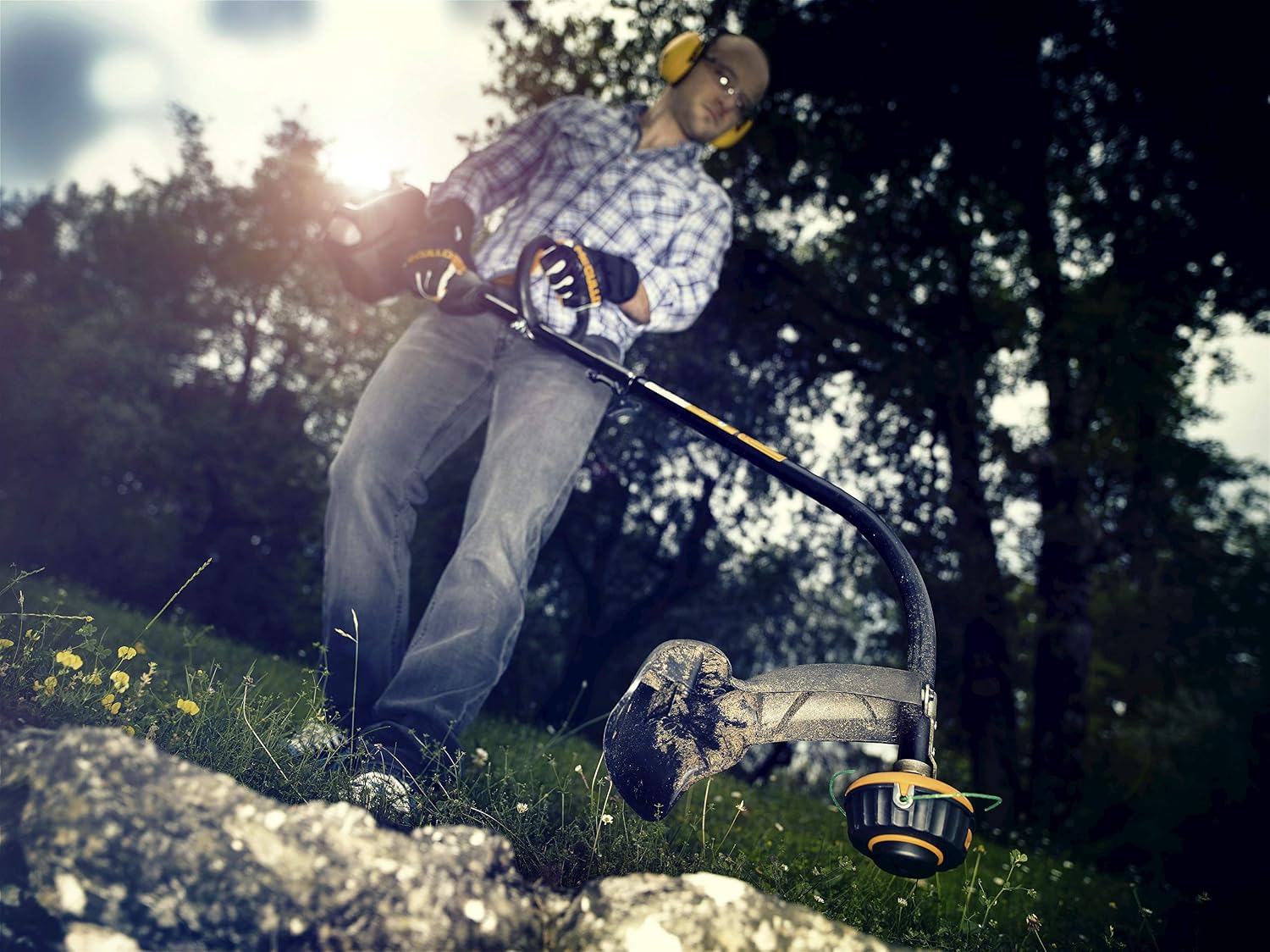 Person operating McCulloch T26 CS Trimmer in a garden