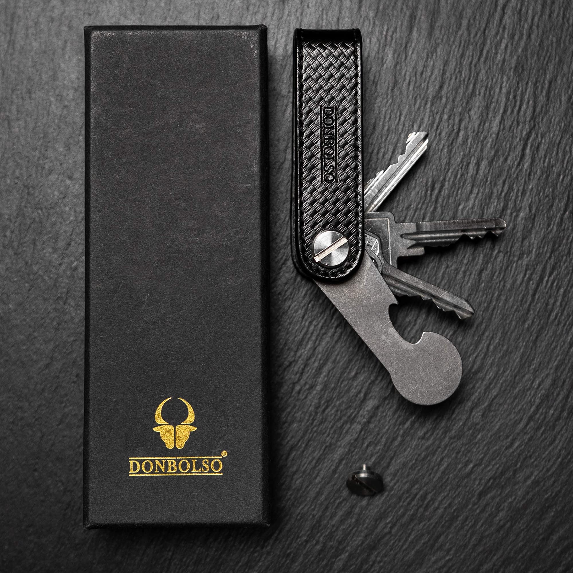 DONBOLSO Llavero One | Organizador Llaves con Liberación de Carro de la Compra | Porta Llaves para 1-7 Llaves | Tornillo de Acero Inoxidable | Carbono y Napa Negro