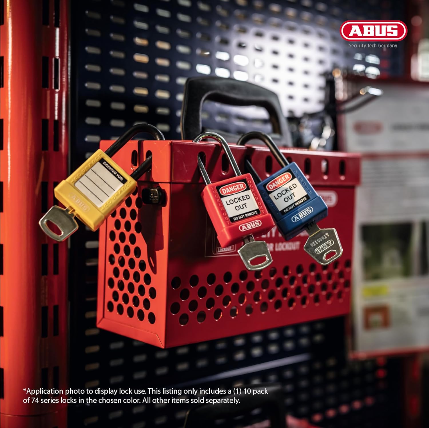 Application photo showing three ABUS lockout tagout padlocks (red, yellow, blue) securing a red lockout box on industrial shelving.