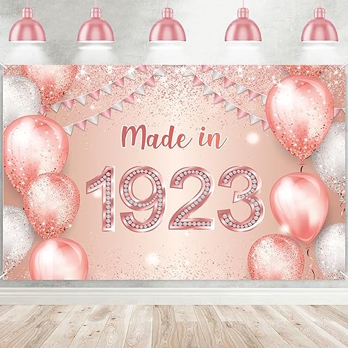 Cartel de feliz cumpleaños número 100 de oro rosa hecho en 1923 con texto en inglés "Cheers to 100 years old ", globo de confeti, decoración