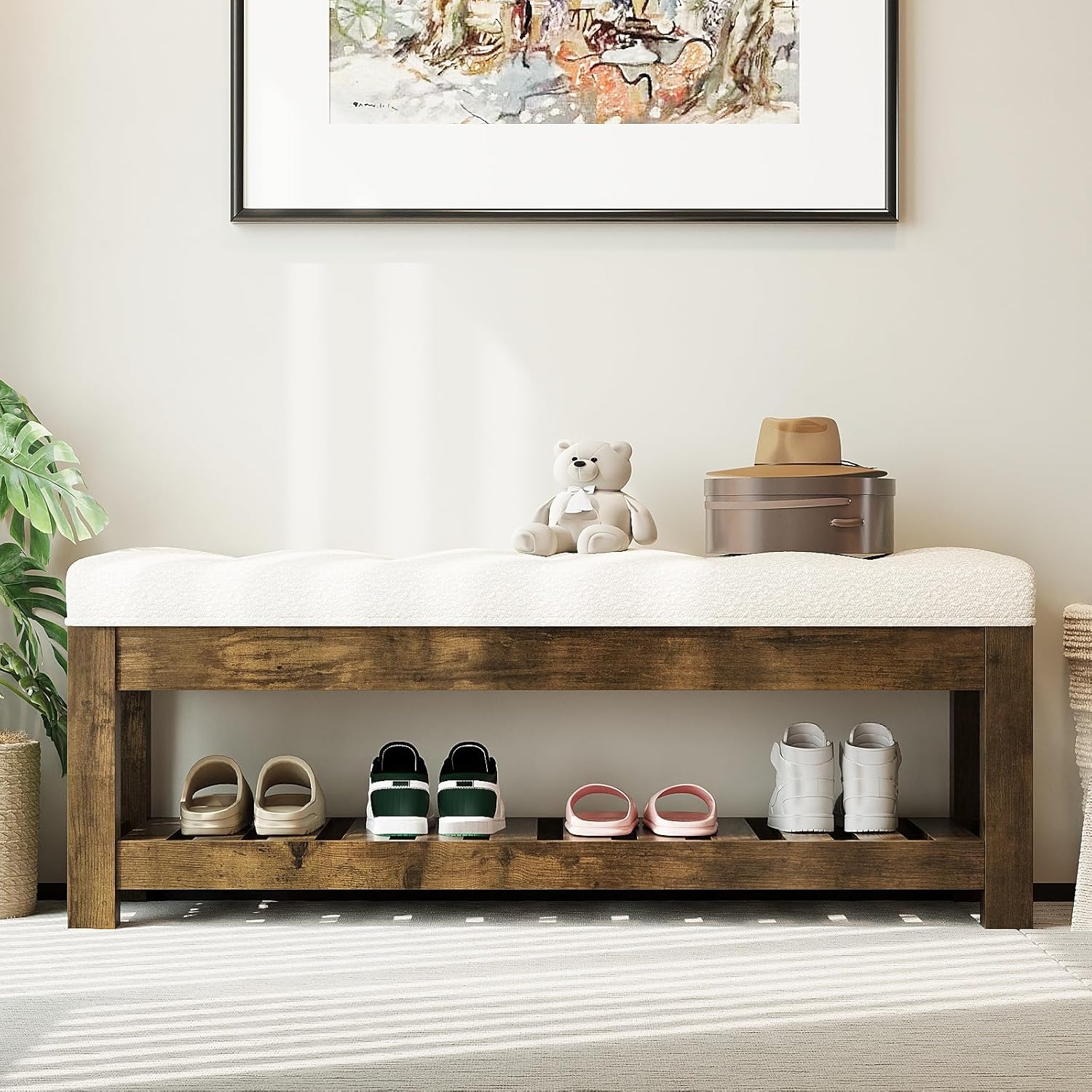 tufted linen ottoman bench styled in bedroom at end of bed
