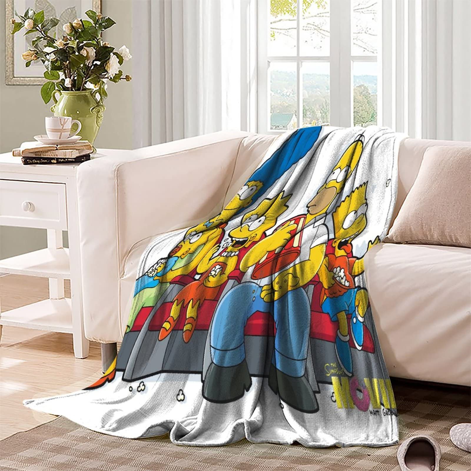 Une couverture faite avec du tissu design et coutures visibles