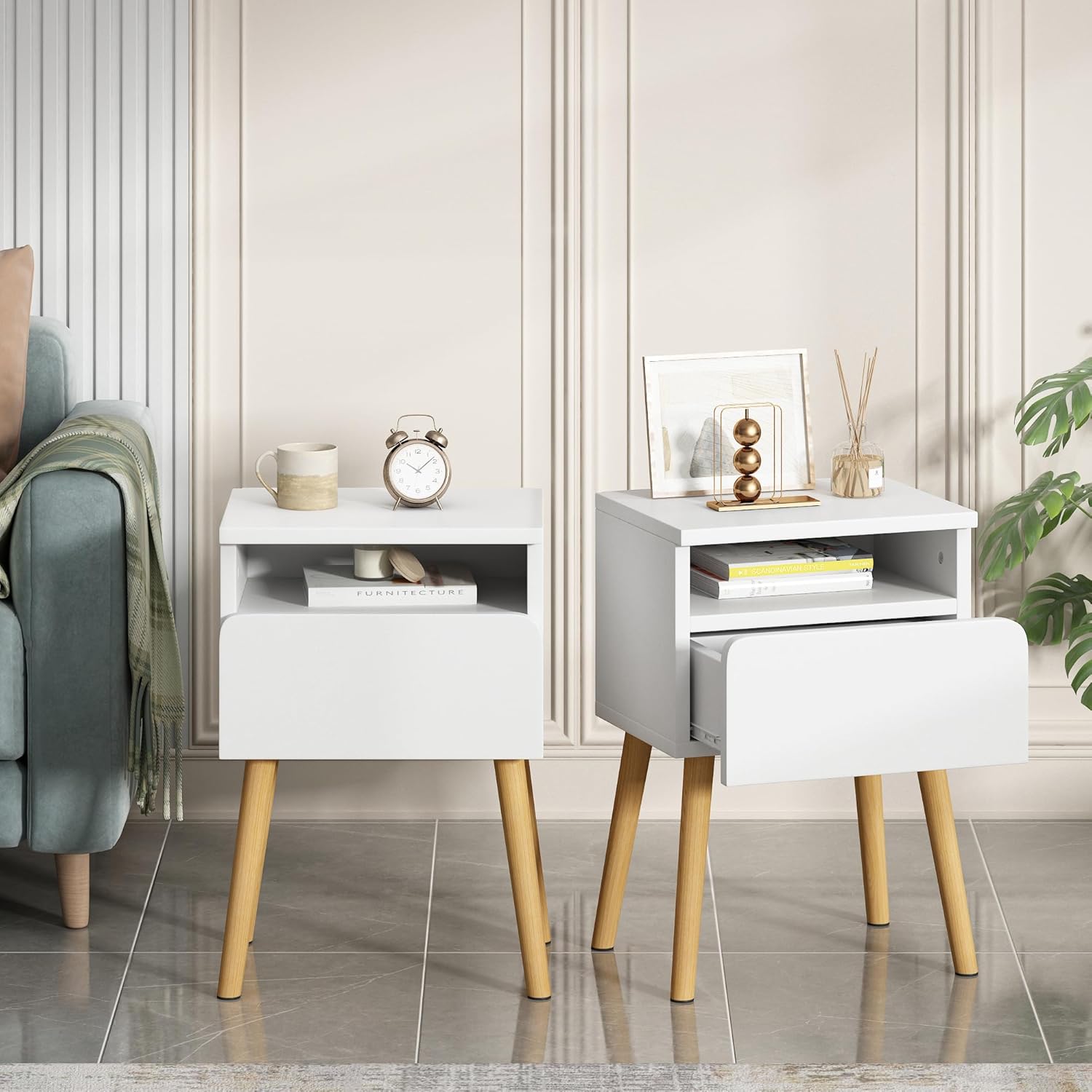 Two JAXPETY Modern Wood Nightstands with drawers, one with the drawer open, placed in a living room setting next to a sofa.