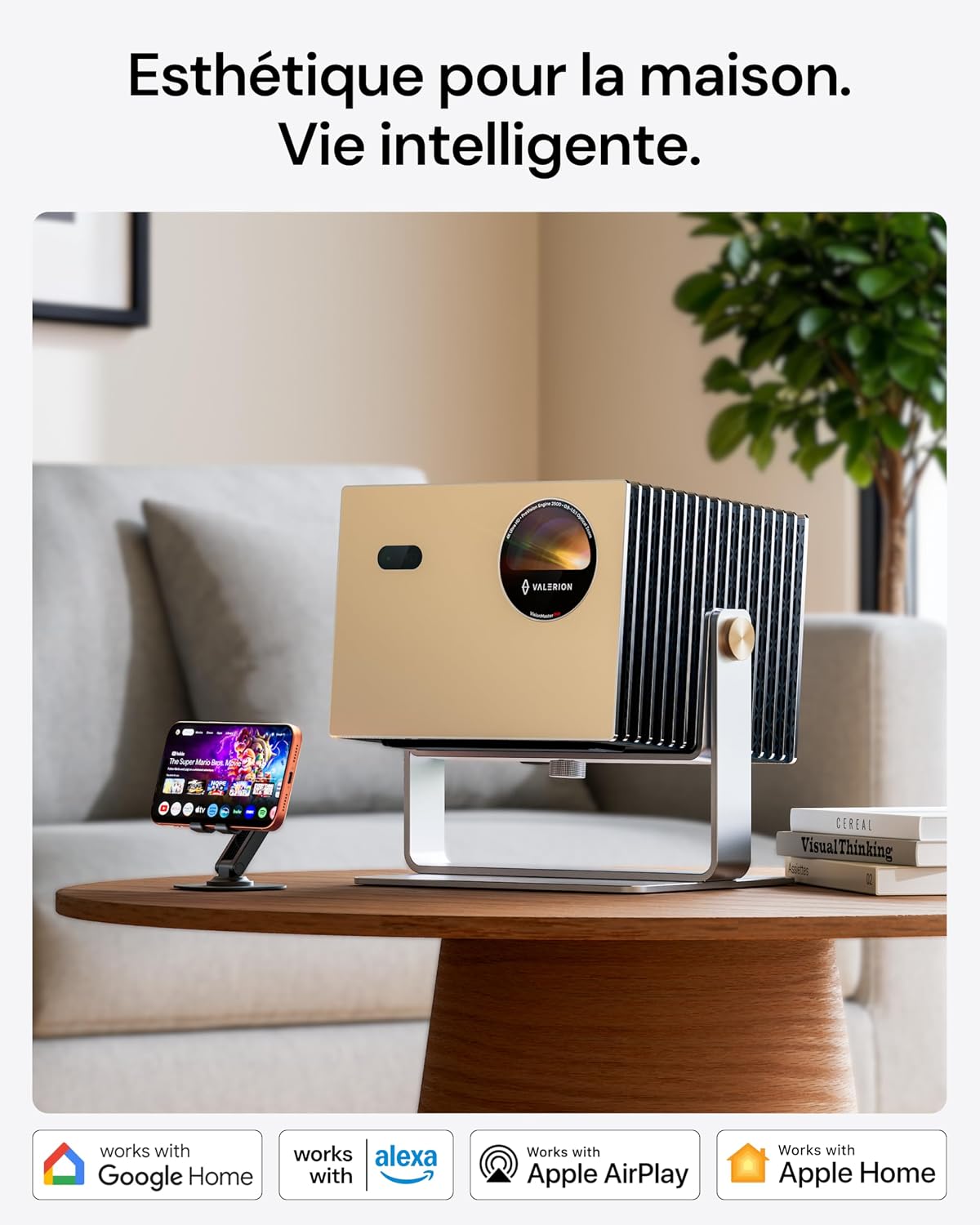 Valerion VisionMaster Pro projector in a living room setting, showing compatibility with Google Home, Alexa, Apple AirPlay, and Apple Home.