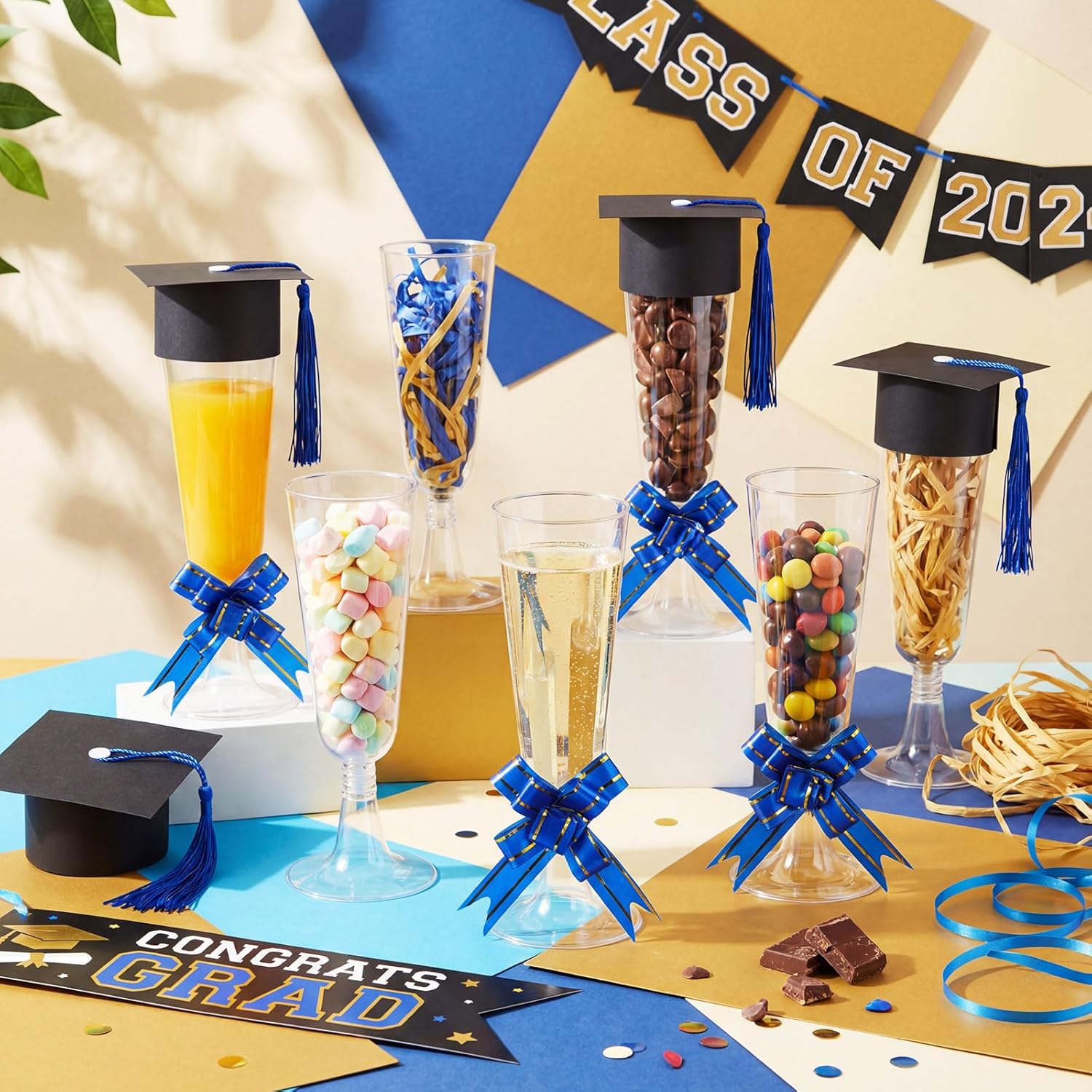 Dunzoom 72 Pack 2026 Graduation Disposable Champagne Flute Set 5 oz Graduate Cocktail Candy Box and Mini Graduation Cap with Tassel Pull Bow Plastic Glasses for Grad Party Table Centerpiece (Blue)