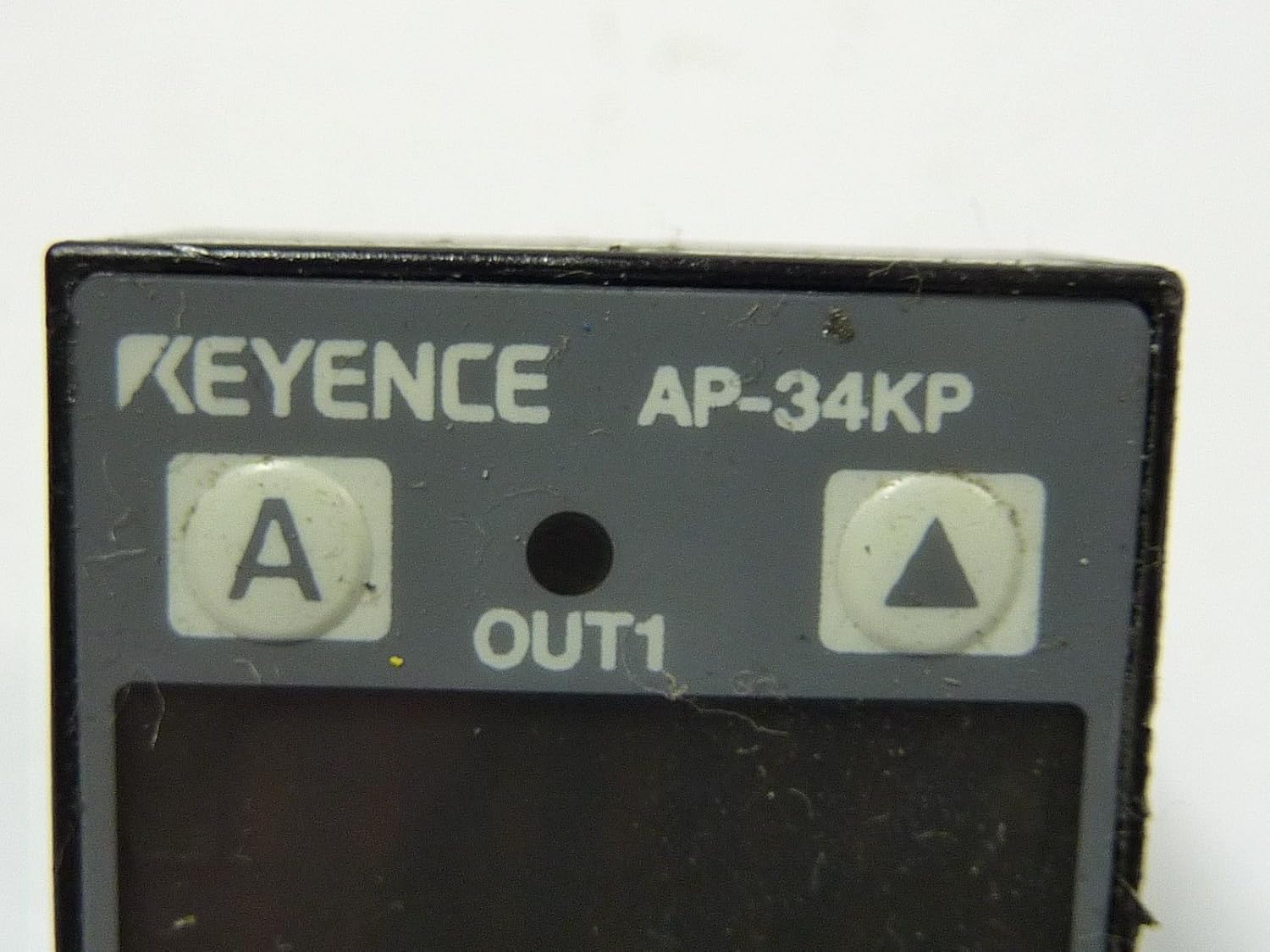 Close-up of the Keyence AP-34KP Pressure Sensor's control panel.