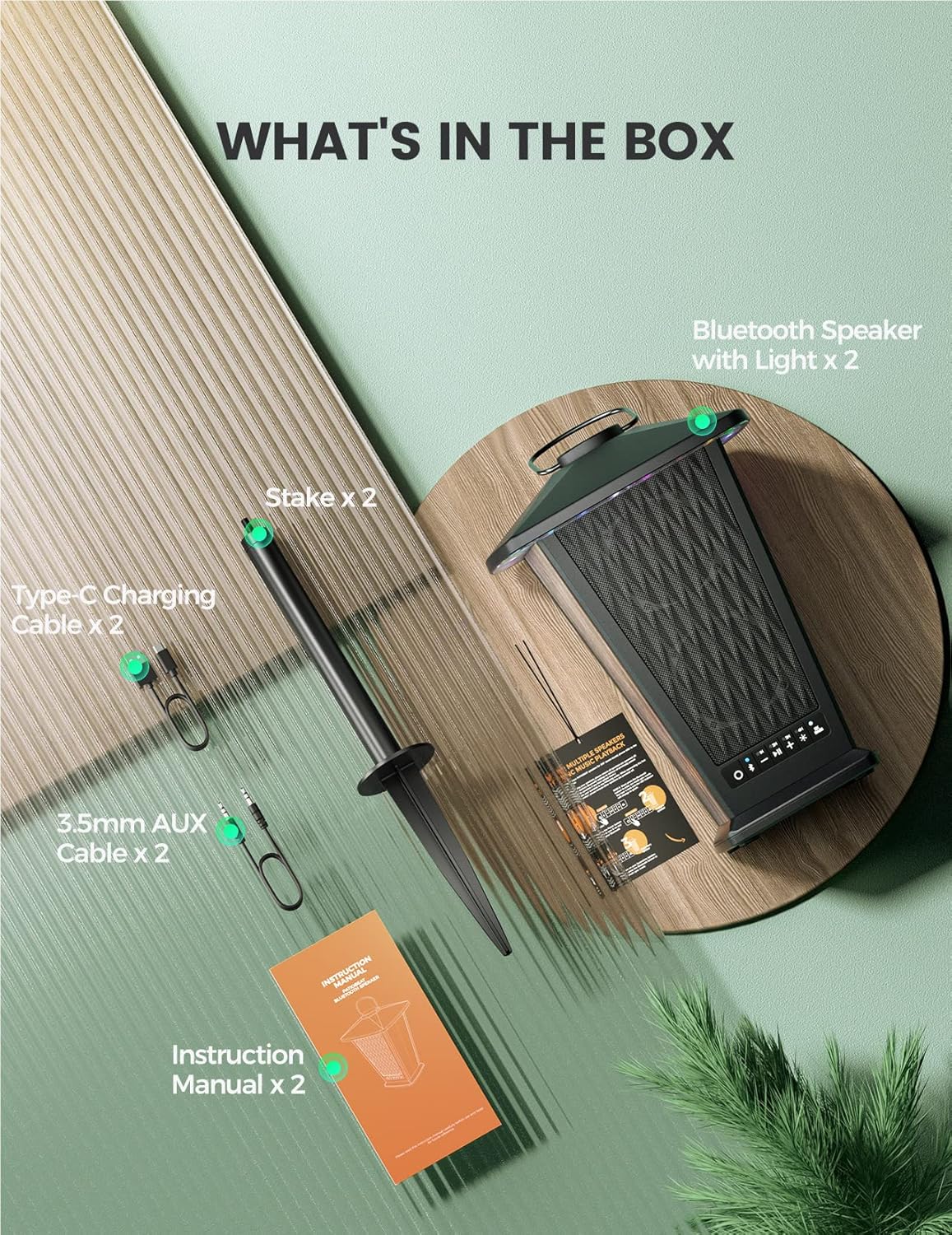 Contents of the BolaButty speaker box including speakers, cables, stakes, and manual