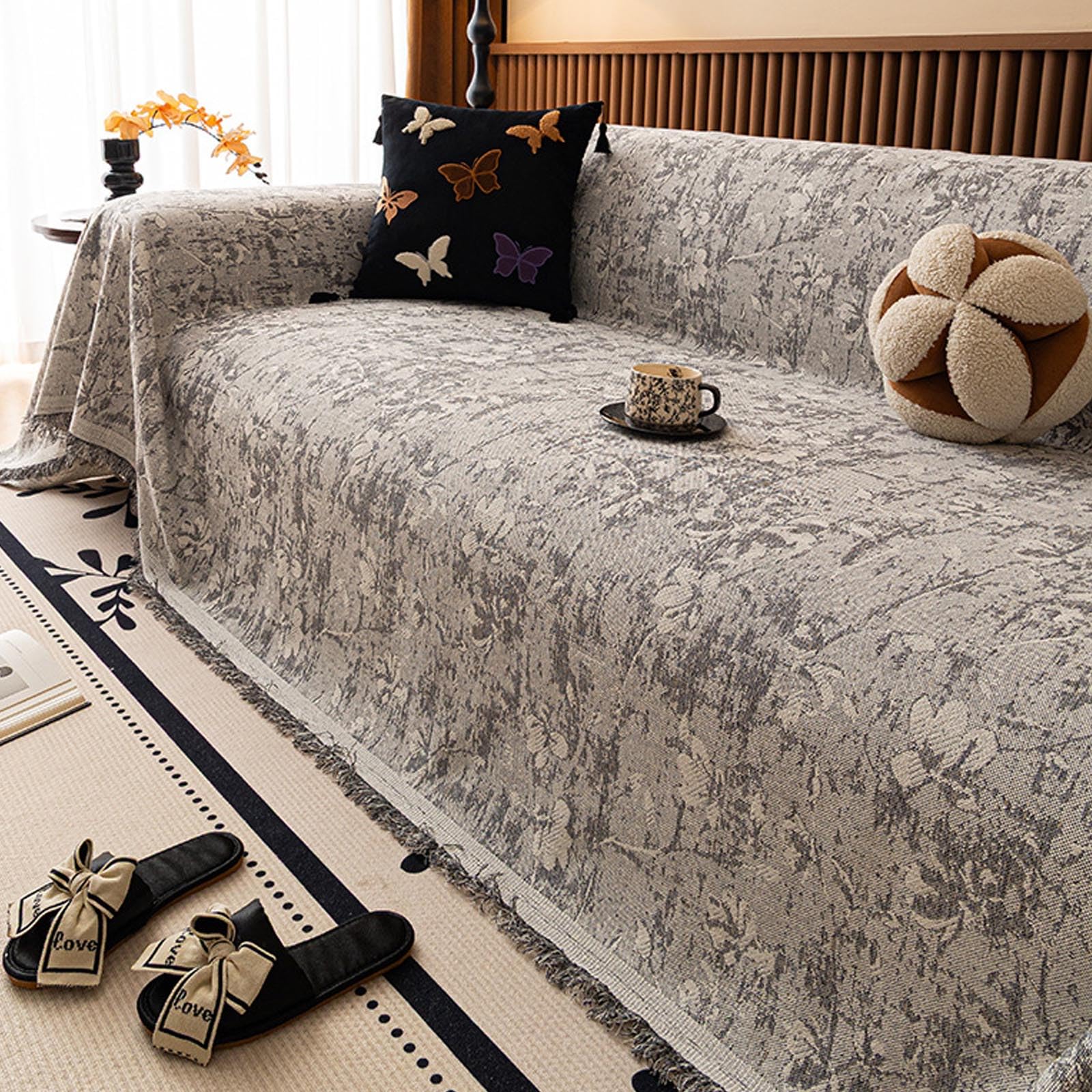 Housse de canapé gris foncé pour sublimer votre décoration de salon
