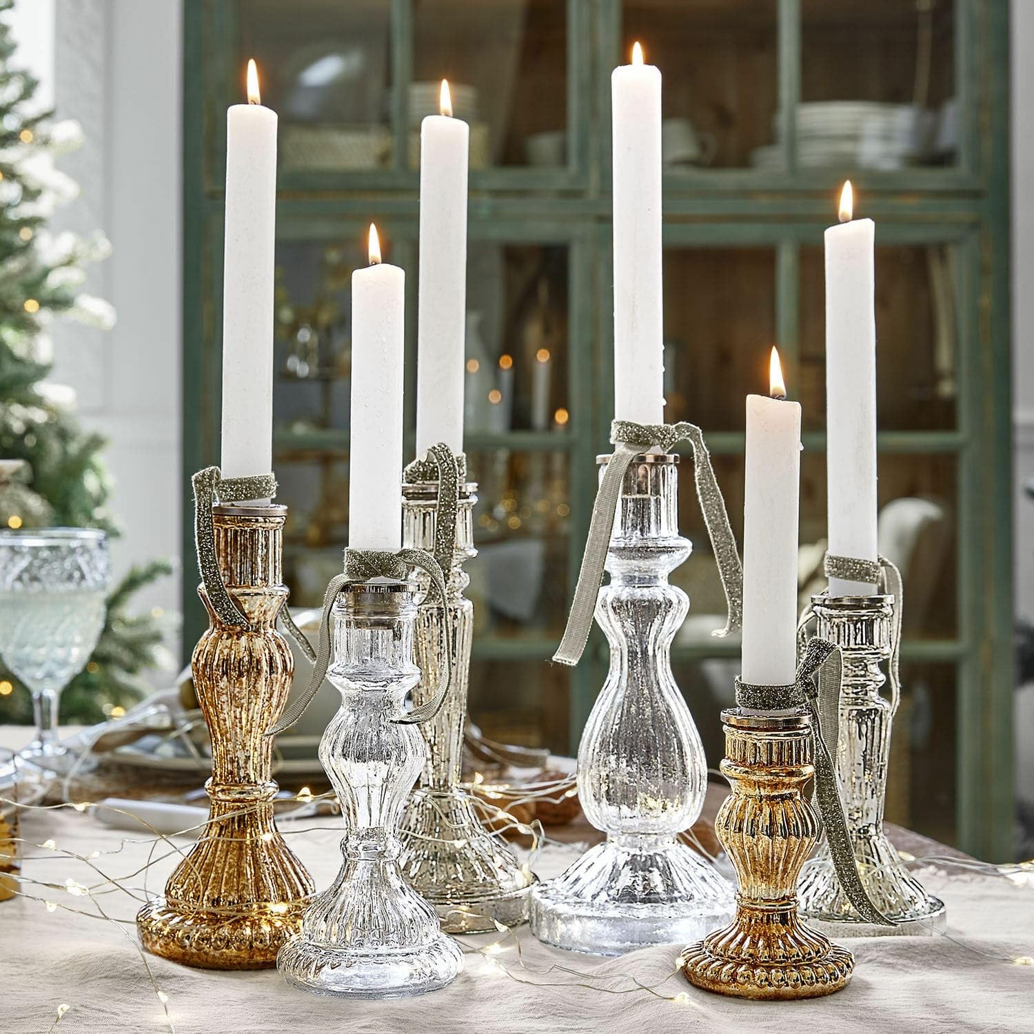 Loberon Kerzenständer 6er Set Quirène, Gold/klar | Mundgeblasen, Sechs Individuelle Designs, Bauernsilber-Finish & Klares Glas, Kerzenhalter, Dekoration, Eisen