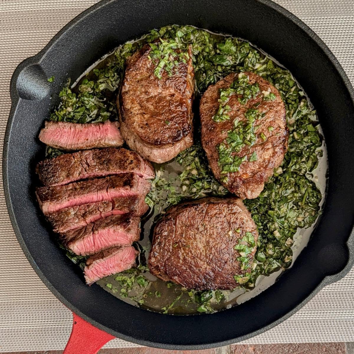 Cooked steaks in a cast iron skillet