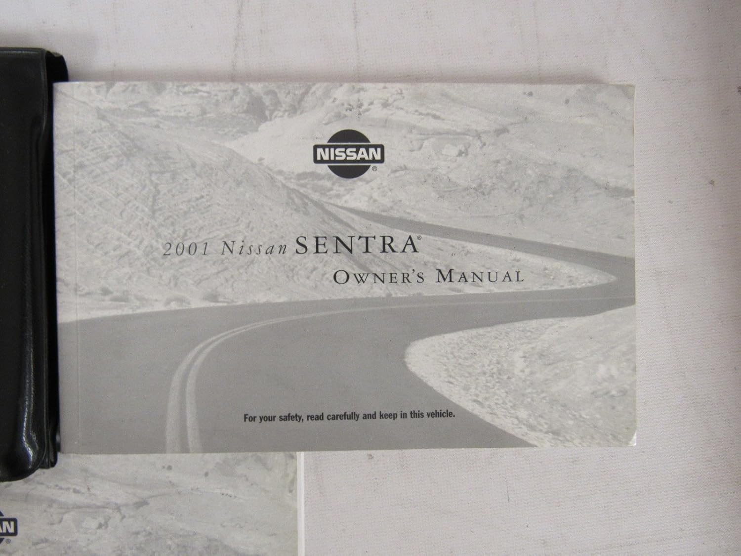 Cover of the Supplement to 2001 Nissan New Vehicle Limited Warranty Information Booklet & 2001 Nissan Owner's Manual.