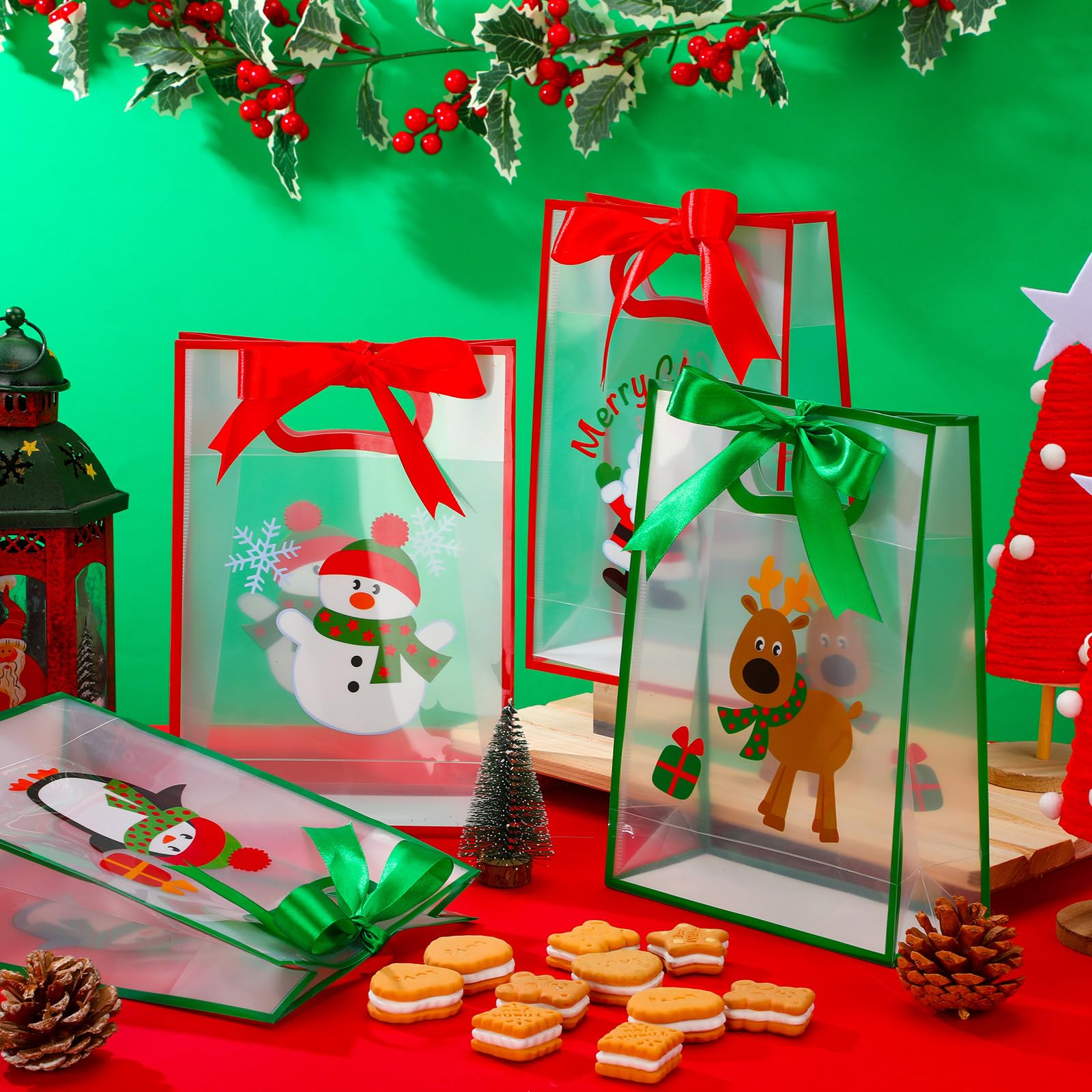 Gersoniel Lot de 24 sacs cadeaux de Noël transparents avec poignées, sacs à friandises de Noël en plastique avec nœud et rubans en PVC transparent, Père Noël, élan, bonhomme de neige pour anniversaire