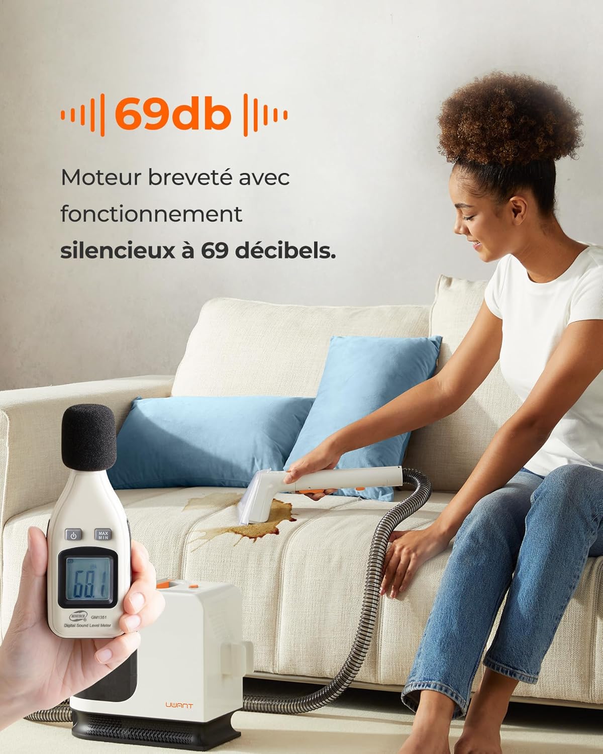Woman cleaning a sofa with Uwant B200 SE, showing 69dB noise level