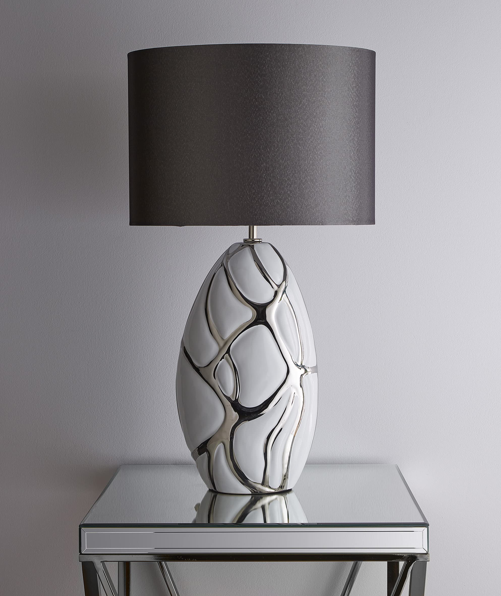 K Living Tall White With Silver Table Lamp In A Ceramic Finish And Dark Grey Lampshade Pebble Style Base Finish from B&Q