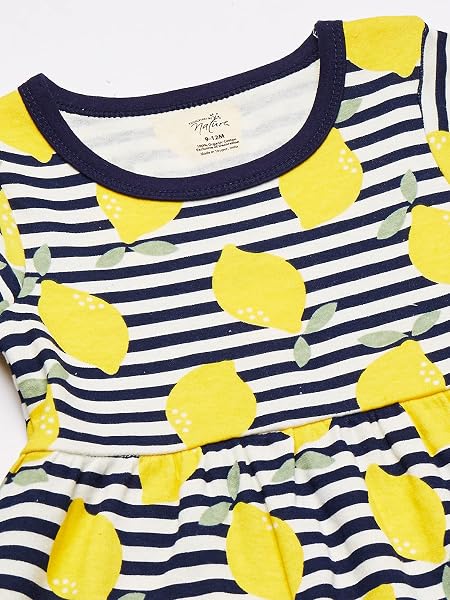 Close-up of vibrant print detail on Touched by Nature organic cotton dress.