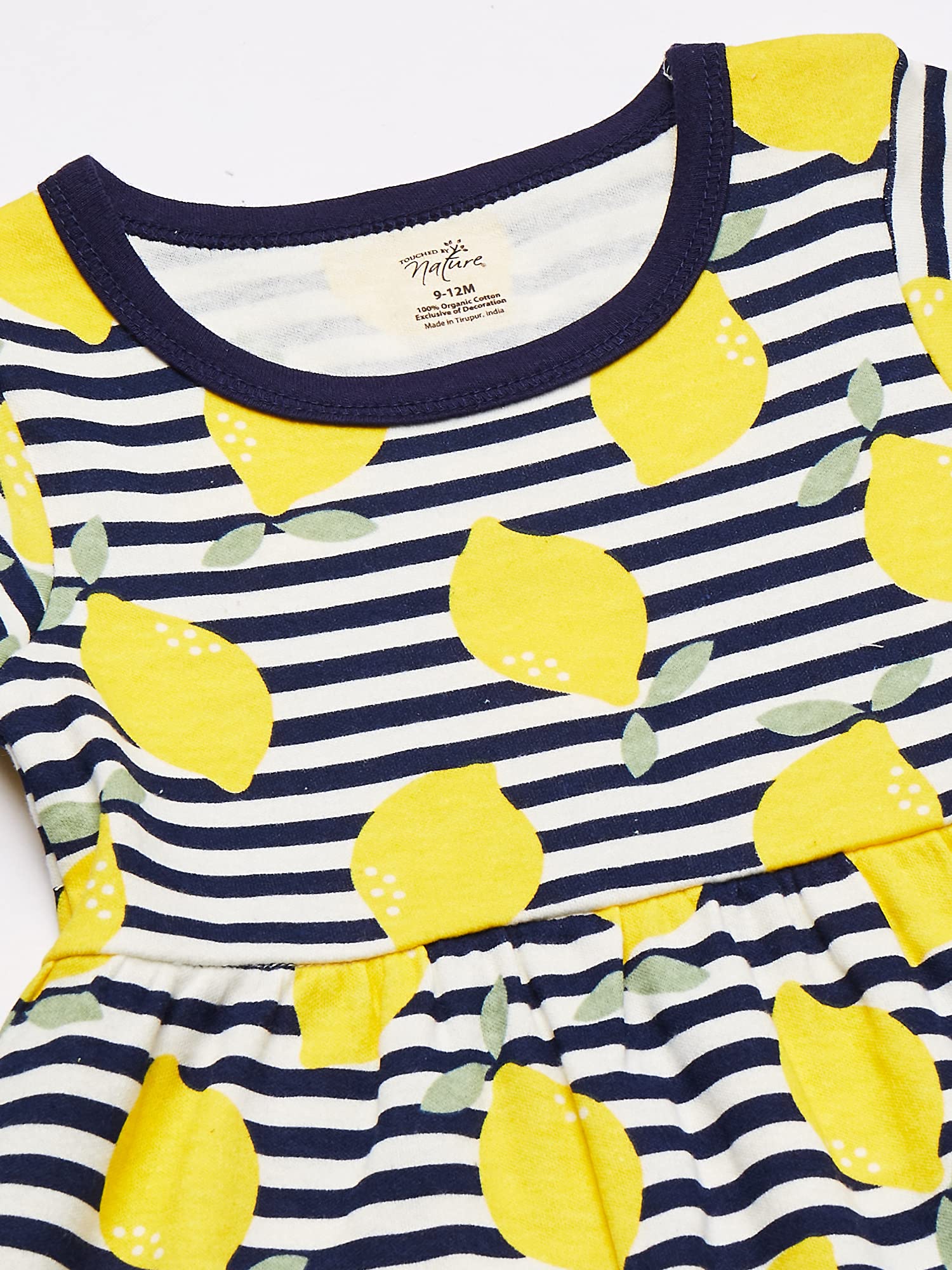 Close-up of vibrant print detail on Touched by Nature organic cotton dress.
