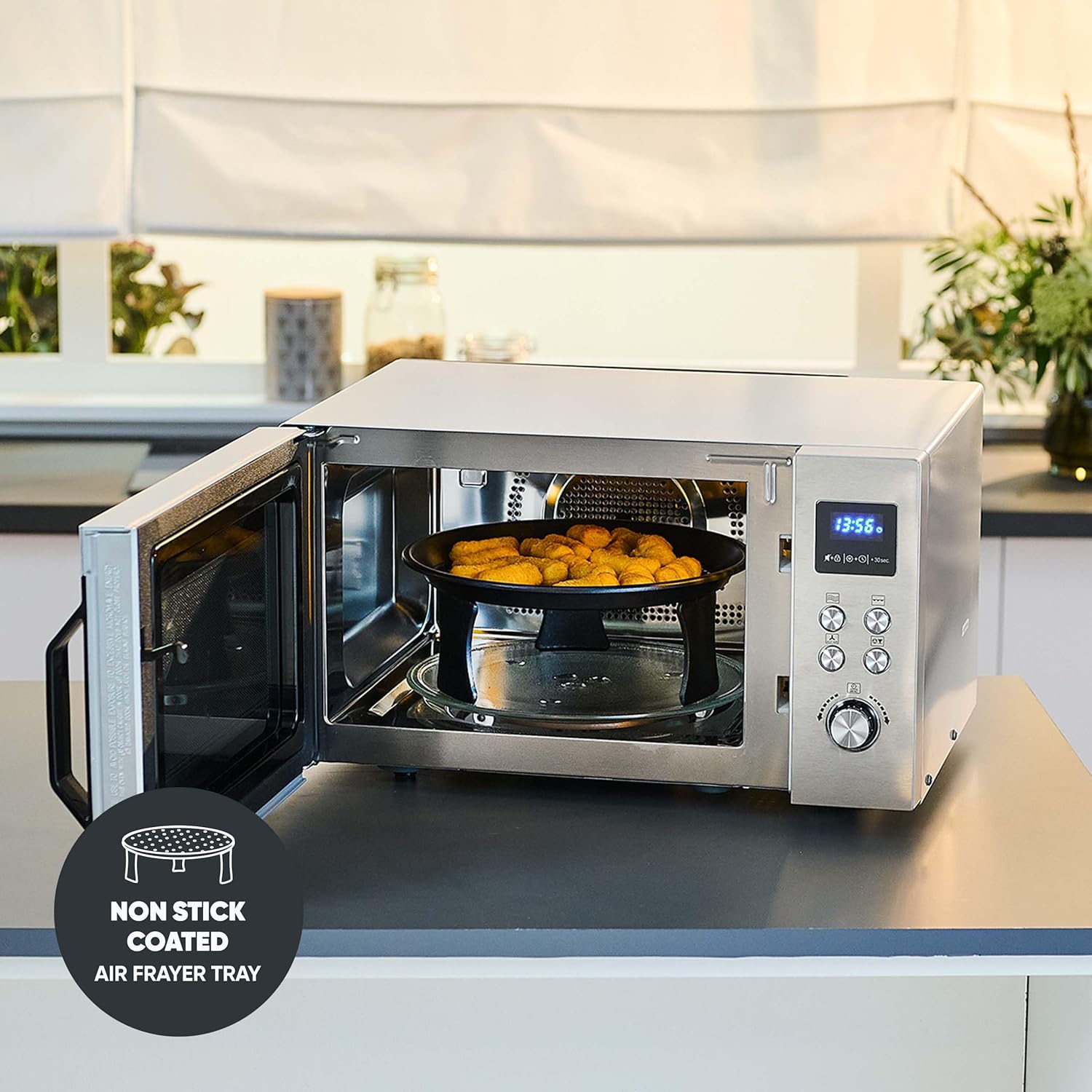 Air fryer tray with food inside the microwave oven