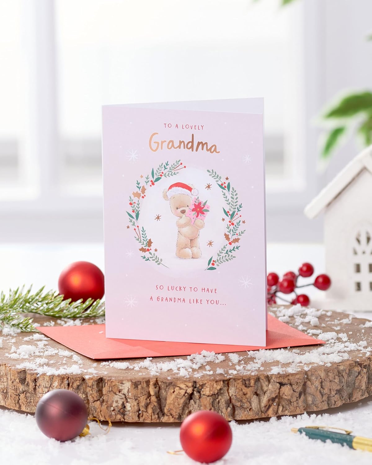 UK Greetings | Christmas Card for Grandma | Xmas Presents | Her, Girls, Women | Nutmeg ML Xmas Grandma bear inside wreath foliage | With Envelope | 17.8 x 12.7 cm