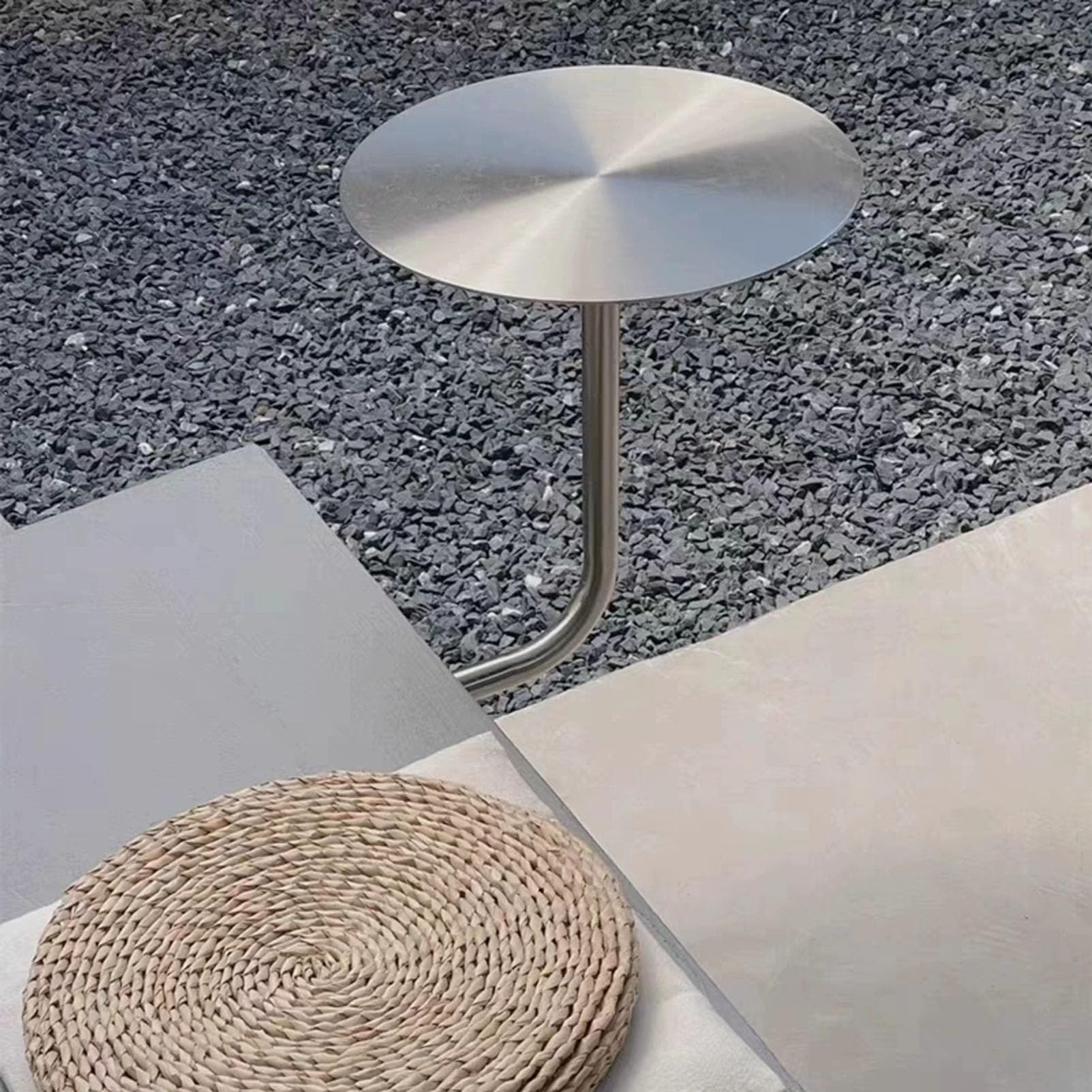 Mesa auxiliar redonda de acero inoxidable de diseño flotante y estetica minimalista premium