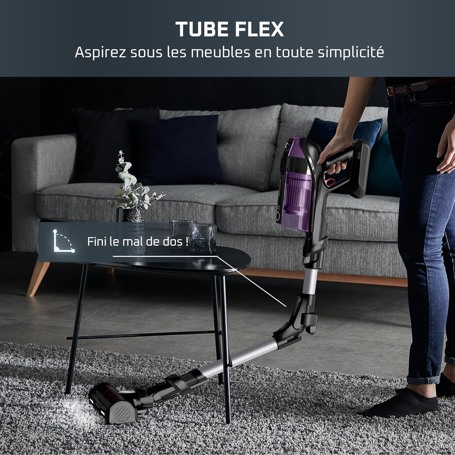 Rowenta X-Force Flex 12.60 vacuum cleaner using its flexible tube to clean under a table