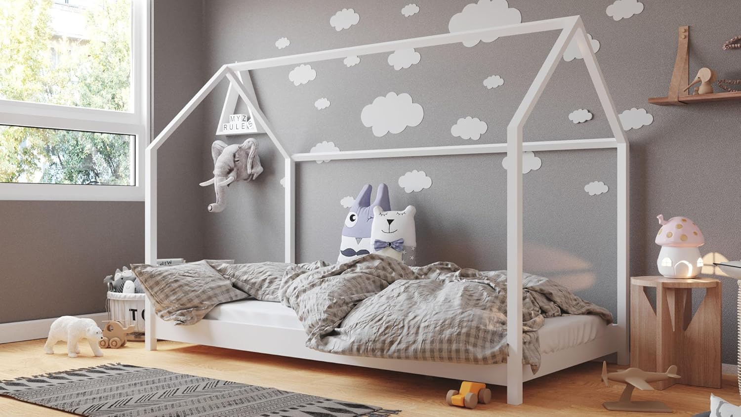 WFL GROUP Montessori House Bed in a child's room with bedding and decorations.